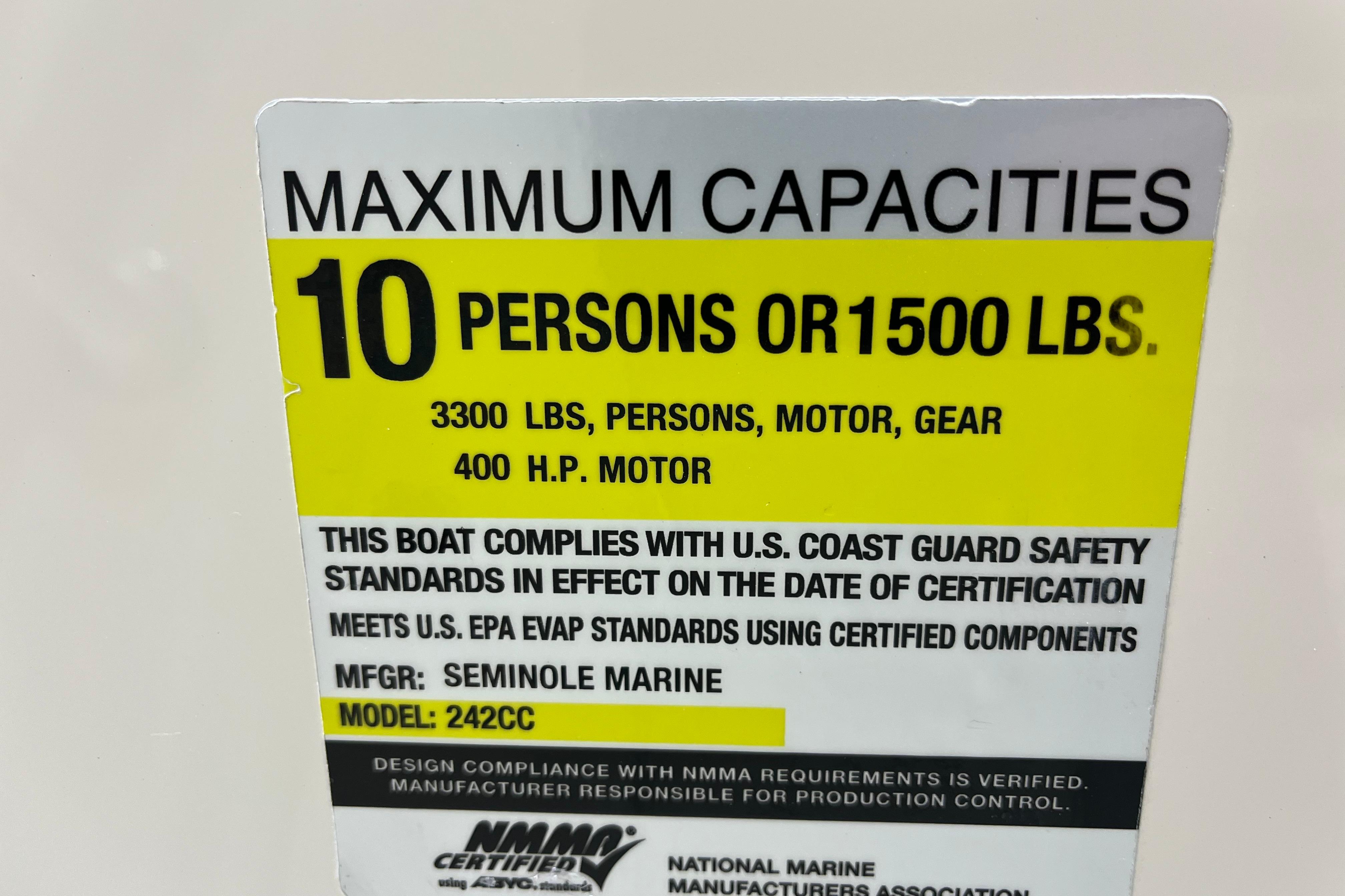 2022 Sailfish 242 CC capacity label: 10 persons or 1500 lbs, 400 HP motor.