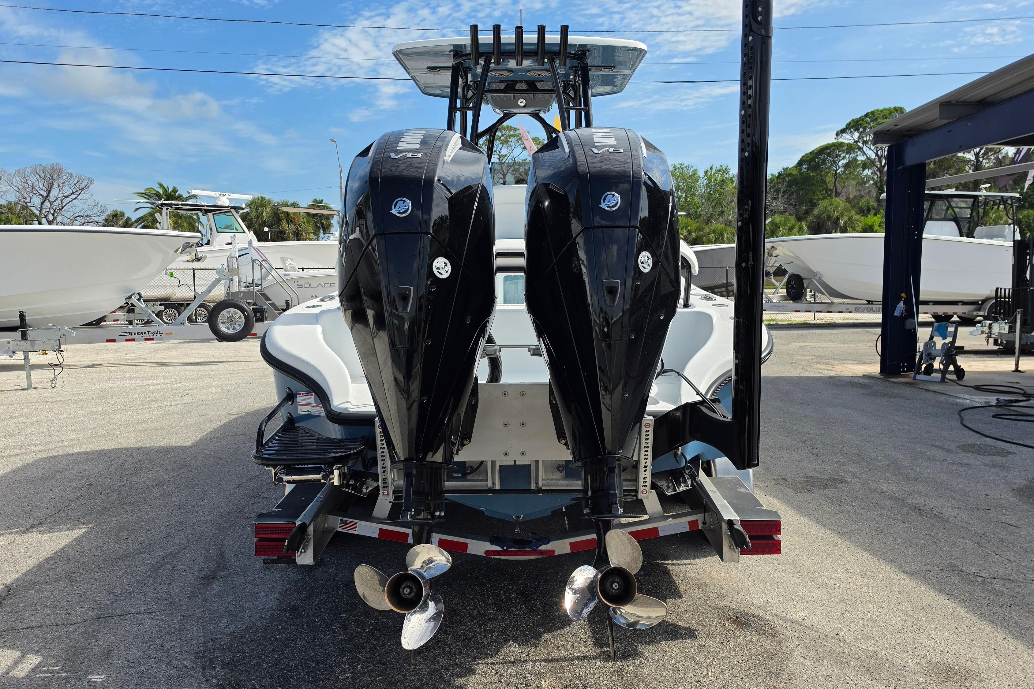 2025 Yellowfin 26 Hybrid boat with dual outboard motors on a trailer.