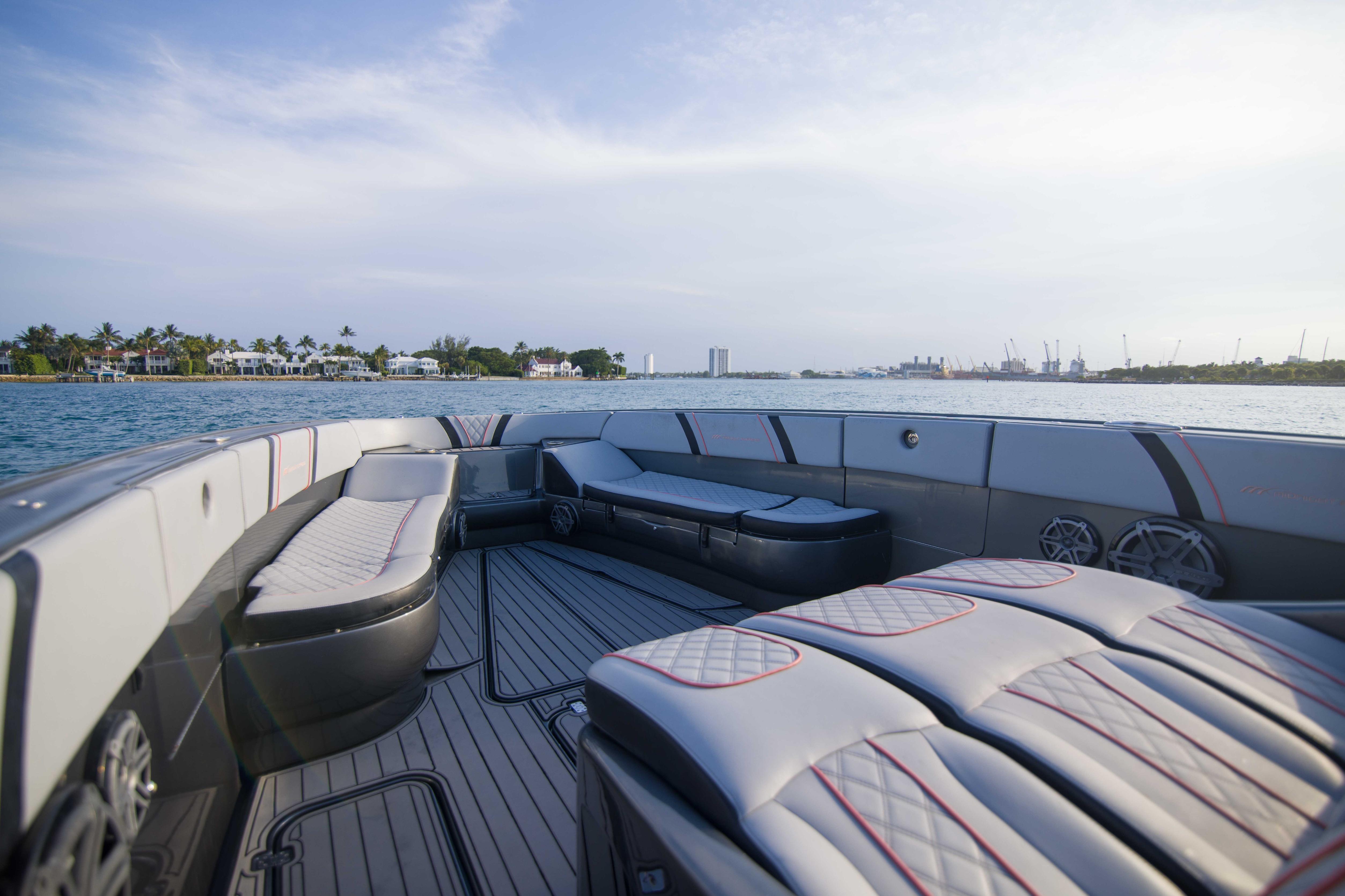 Luxurious 2019 Midnight Express 43 Open boat interior with waterfront view.