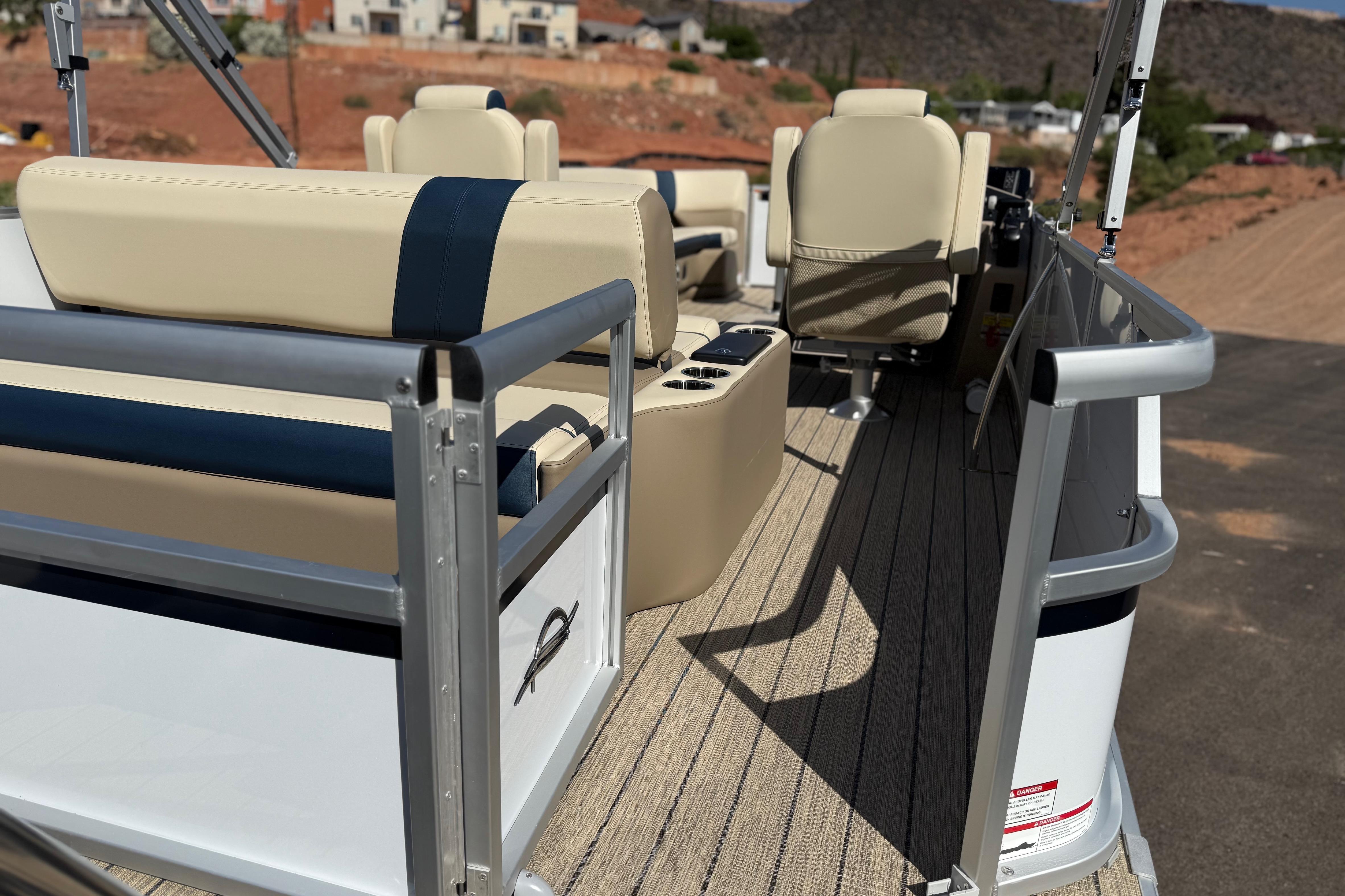 2026 SunCatcher Select 322SL pontoon boat interior with beige seating and sleek design.