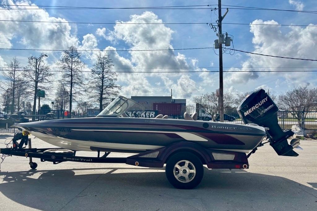 2008 Ranger 180 Reata boat on trailer with Mercury outboard motor, parked outdoors.