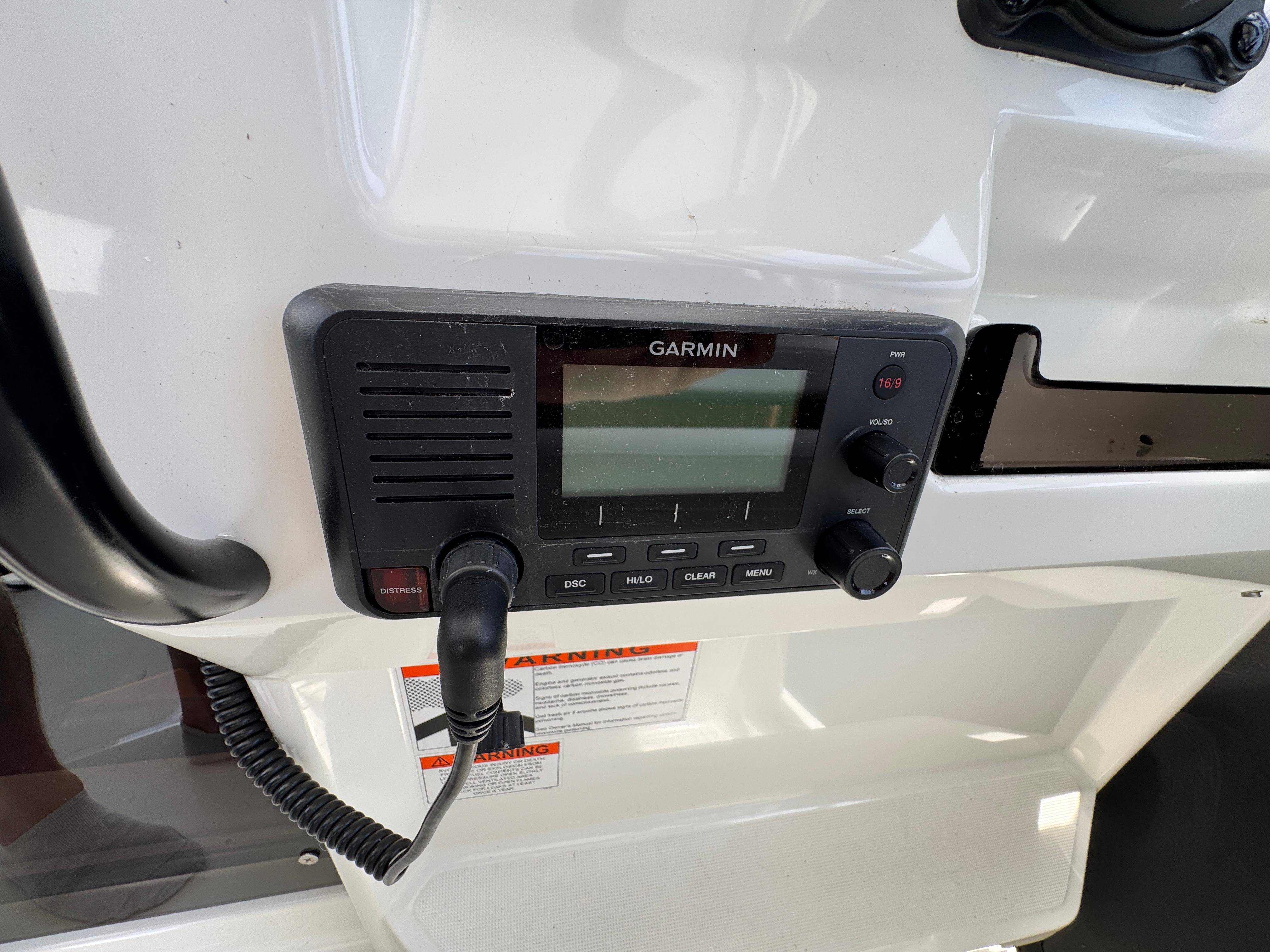 Garmin marine radio on 2022 Beneteau Flyer 9 SUNdeck boat dashboard.