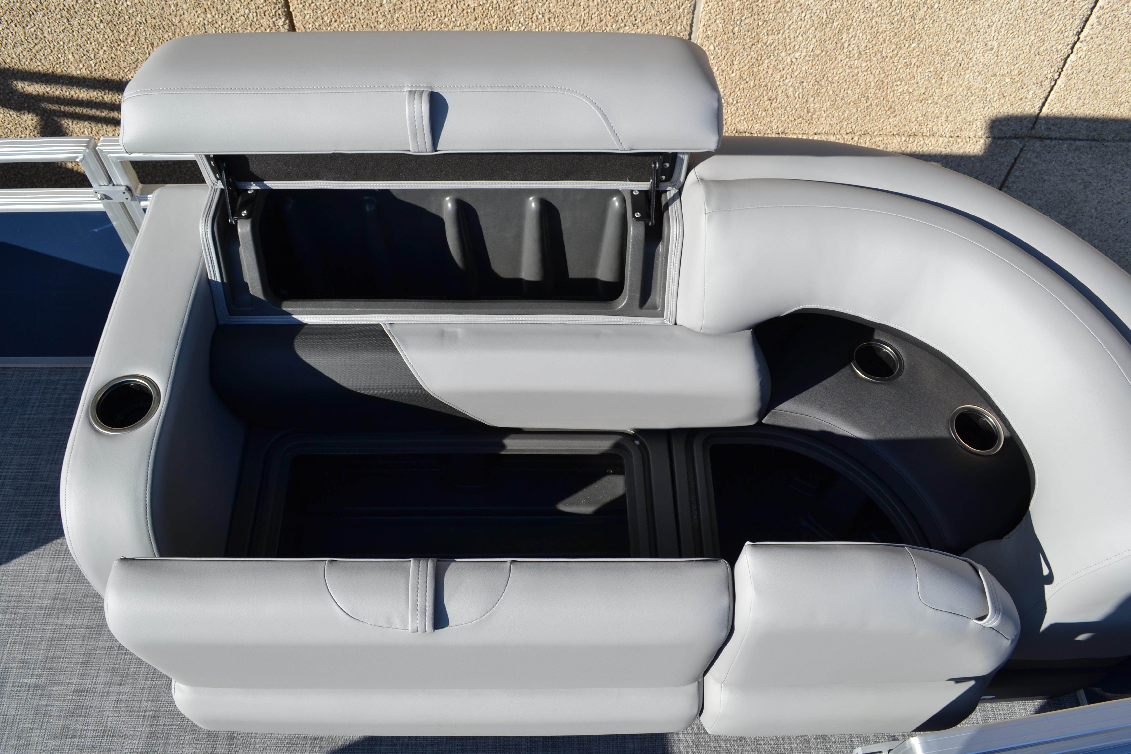 2026 Sun Tracker SportFish 22 XP3 boat seating with storage and cup holders.