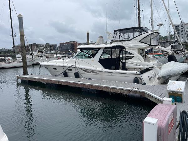 2003 Tiara Yachts 3500 Open docked in a marina, surrounded by other boats.