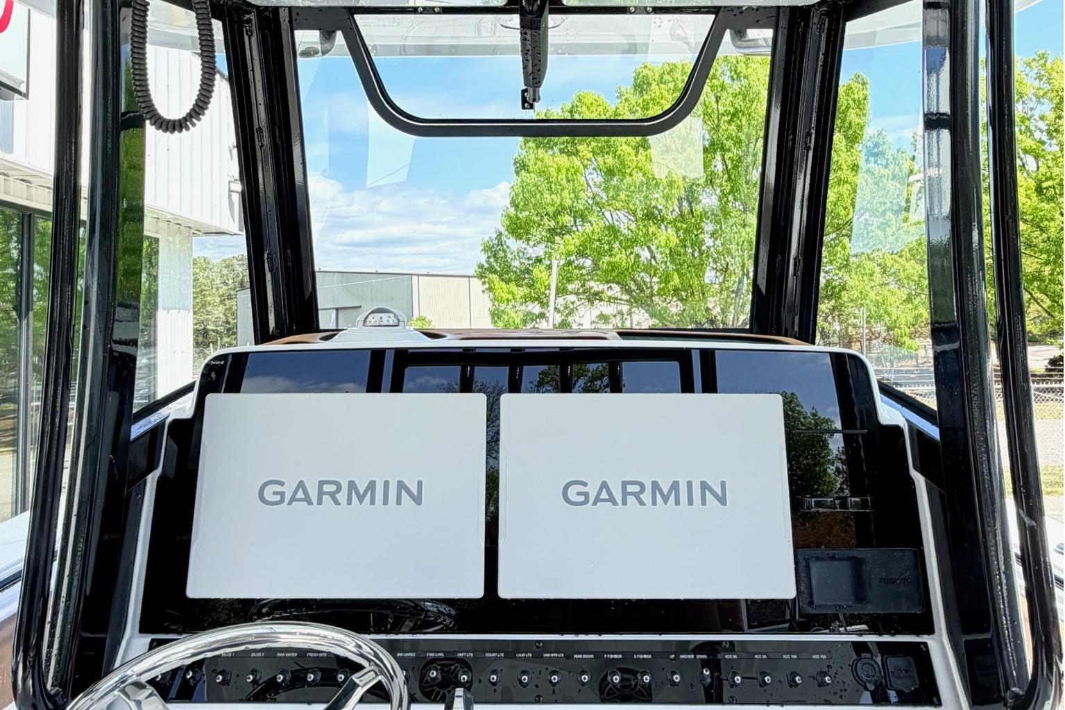 2026 Seahunt Ultra 305 CB cockpit with dual Garmin displays and steering wheel.