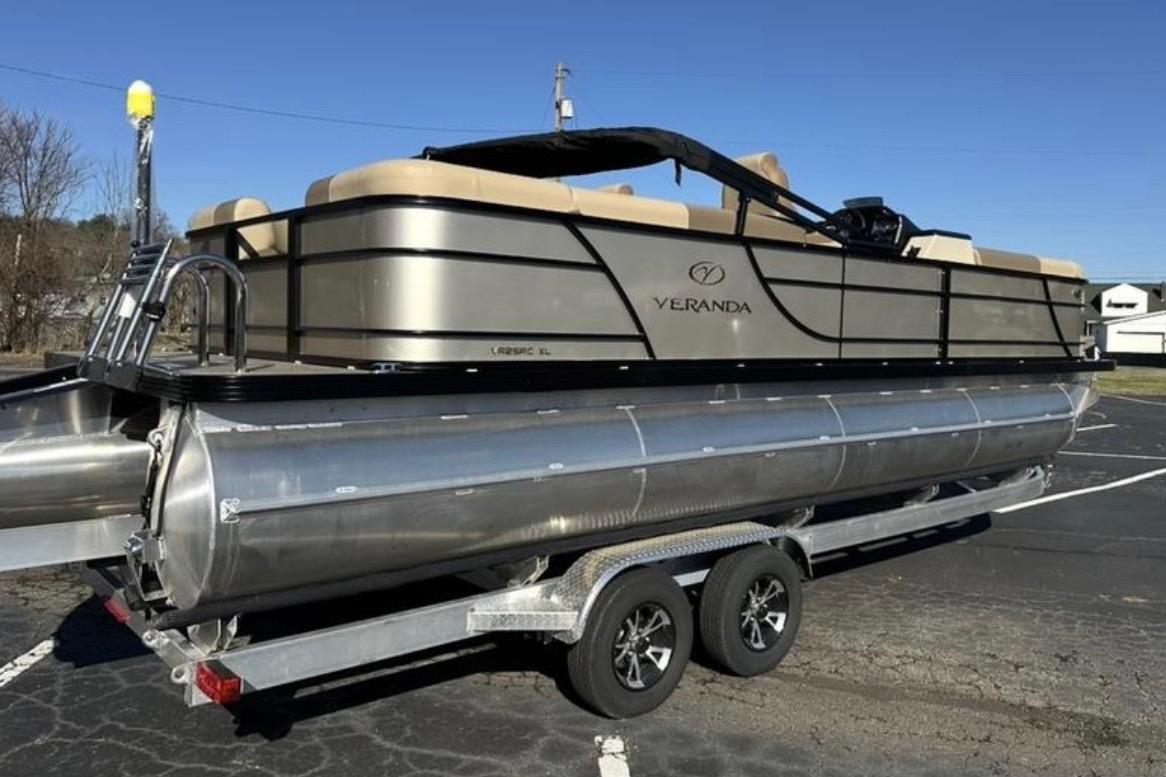 2025 Veranda VR25RC XL pontoon boat on trailer in parking lot.