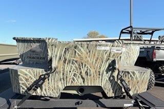 2026 Tracker Grizzly 1650 T Prairie Wings Edition with camouflage design on a trailer.
