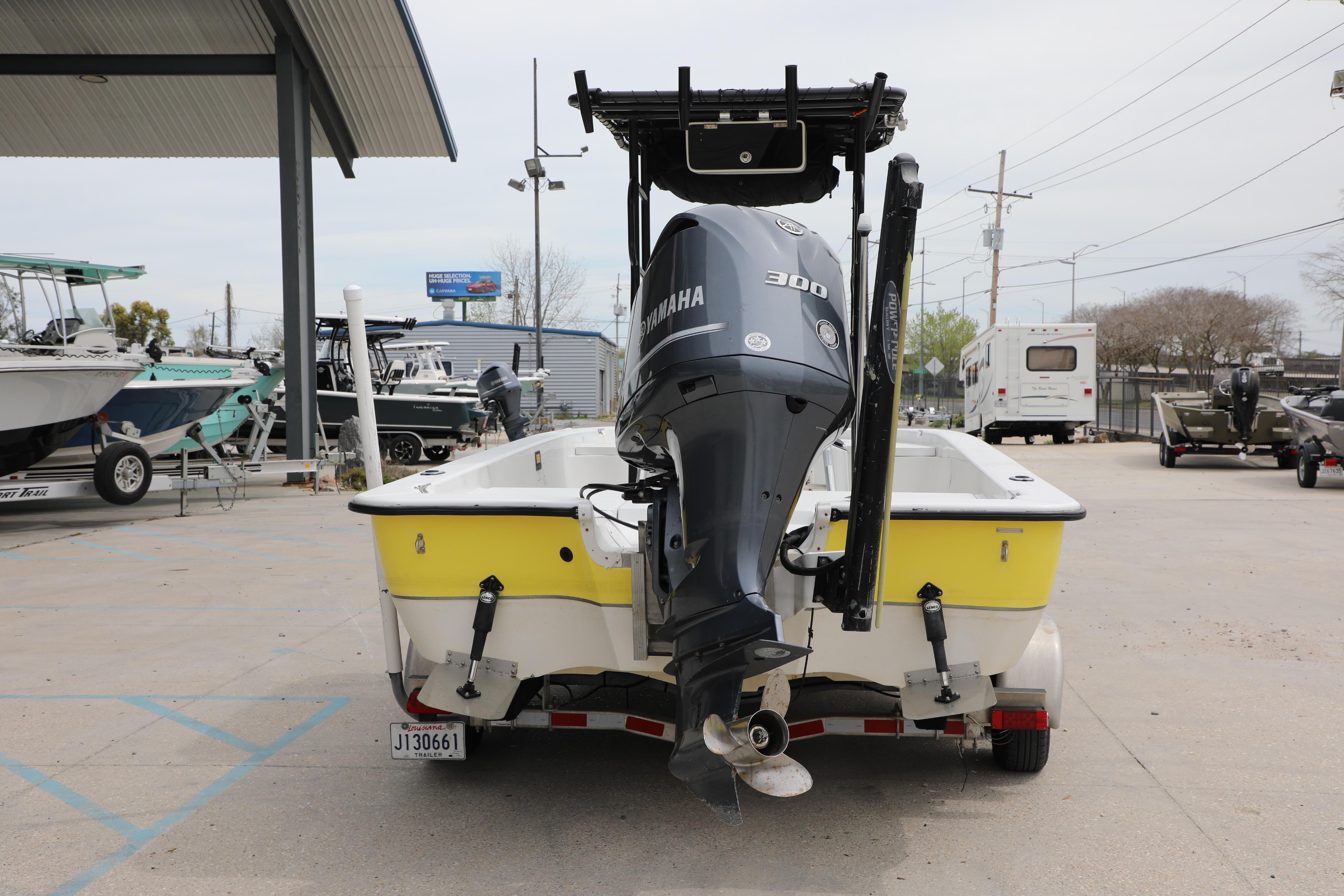 2002 Ranger 2300 Bay Ranger boat with Yamaha 300 engine in a marina setting.