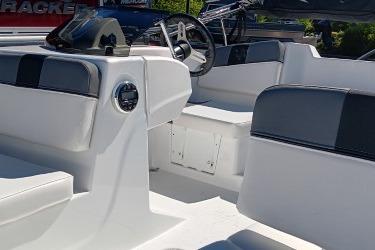 2026 Tahoe T16 boat interior with modern seating and steering wheel.
