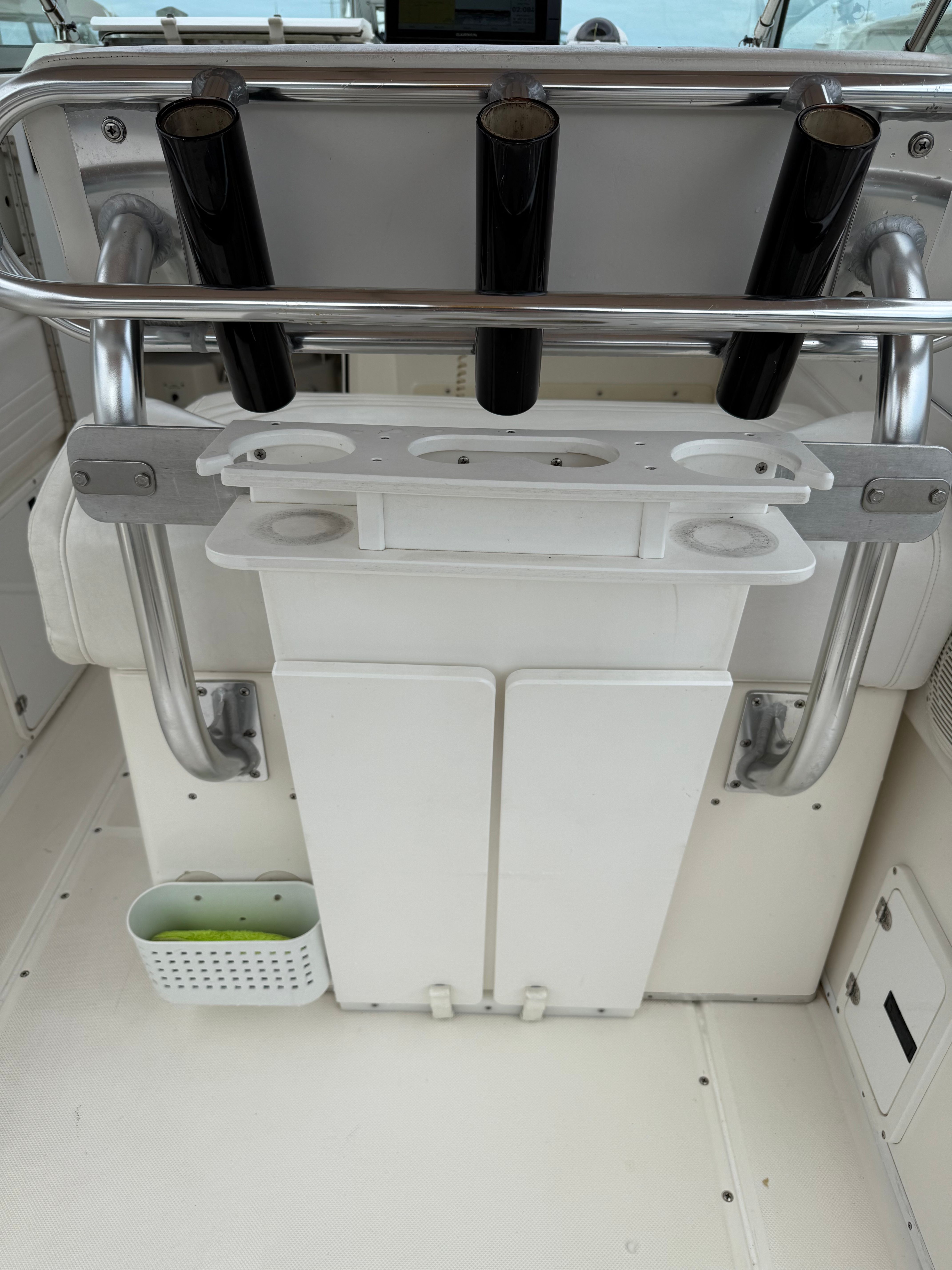 Interior of a 1999 Fountain 32 Sport Fish Cruiser with fishing rod holders.