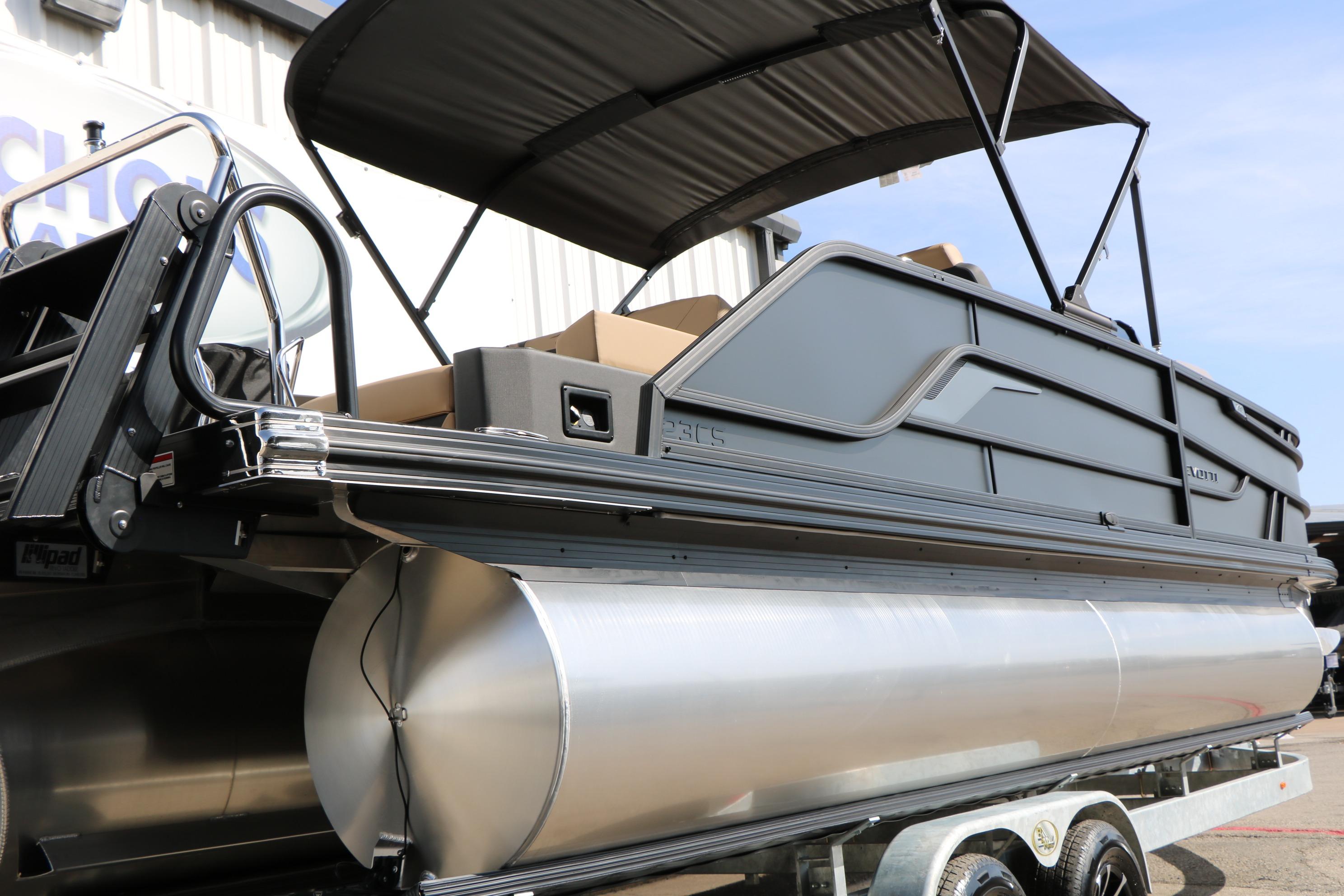 2026 Evotti 723CS pontoon boat with sleek design and canopy, displayed on a trailer.