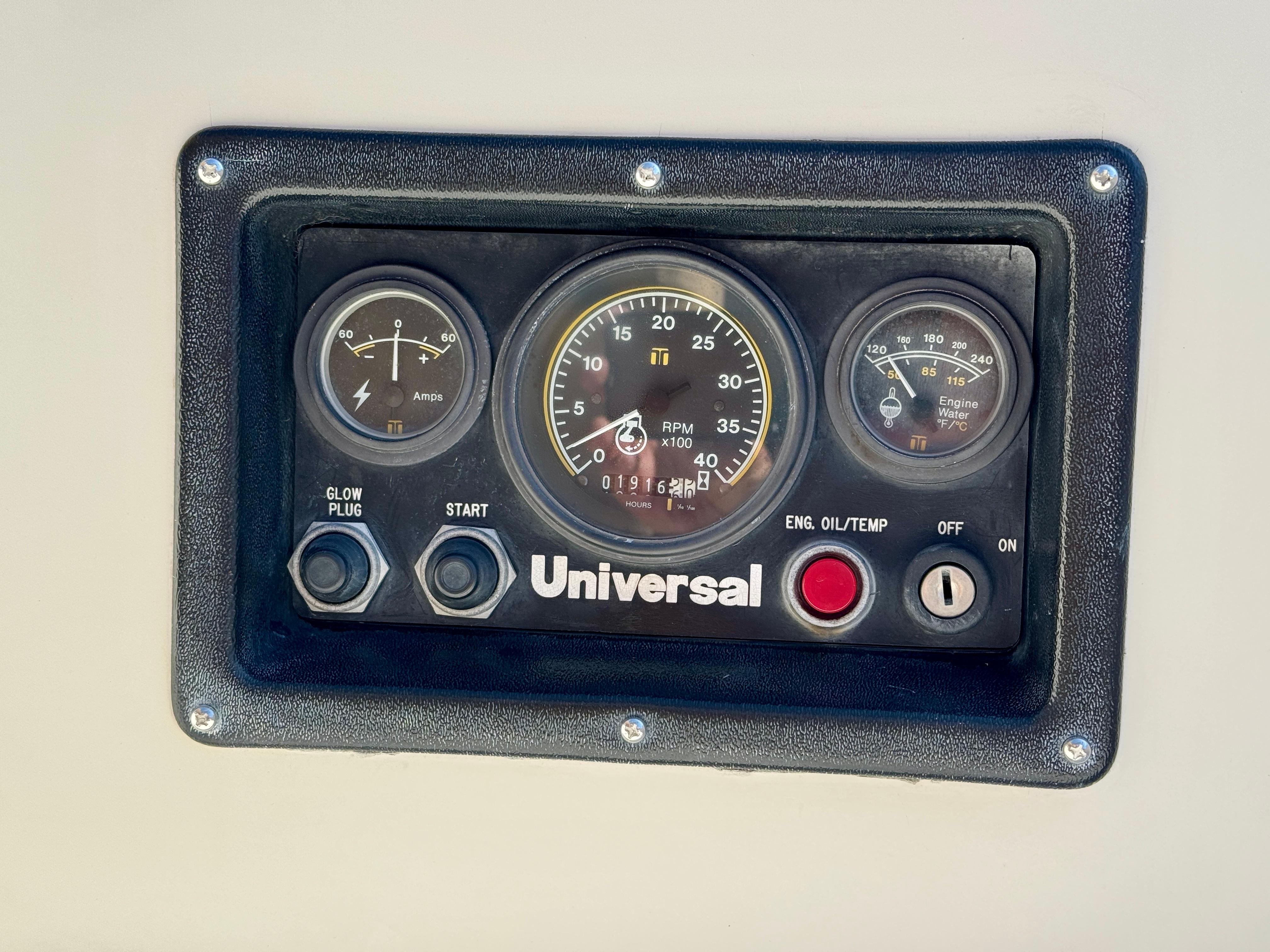 Control panel of a 1989 Nonsuch 30 Ultra sailboat with gauges and switches.