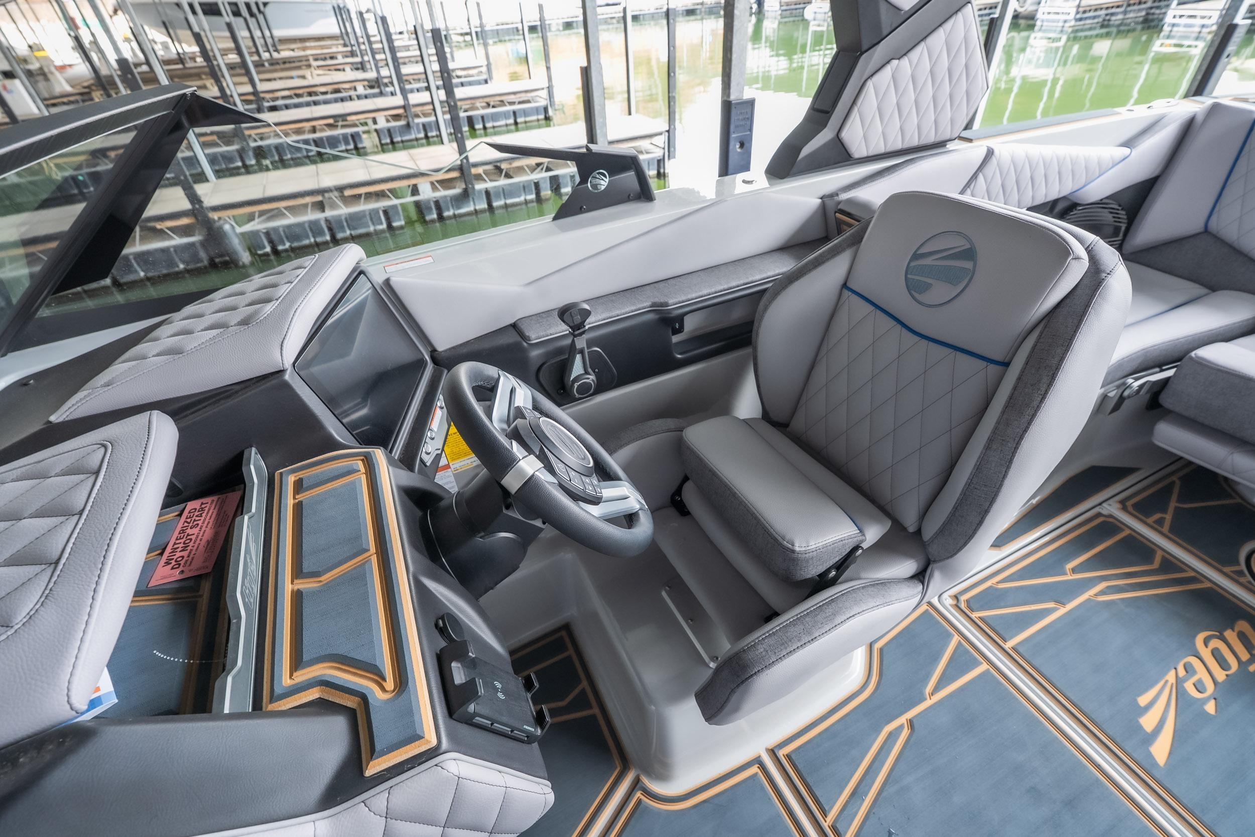 2026 Tigé Z3 boat interior with modern steering and luxurious seating.