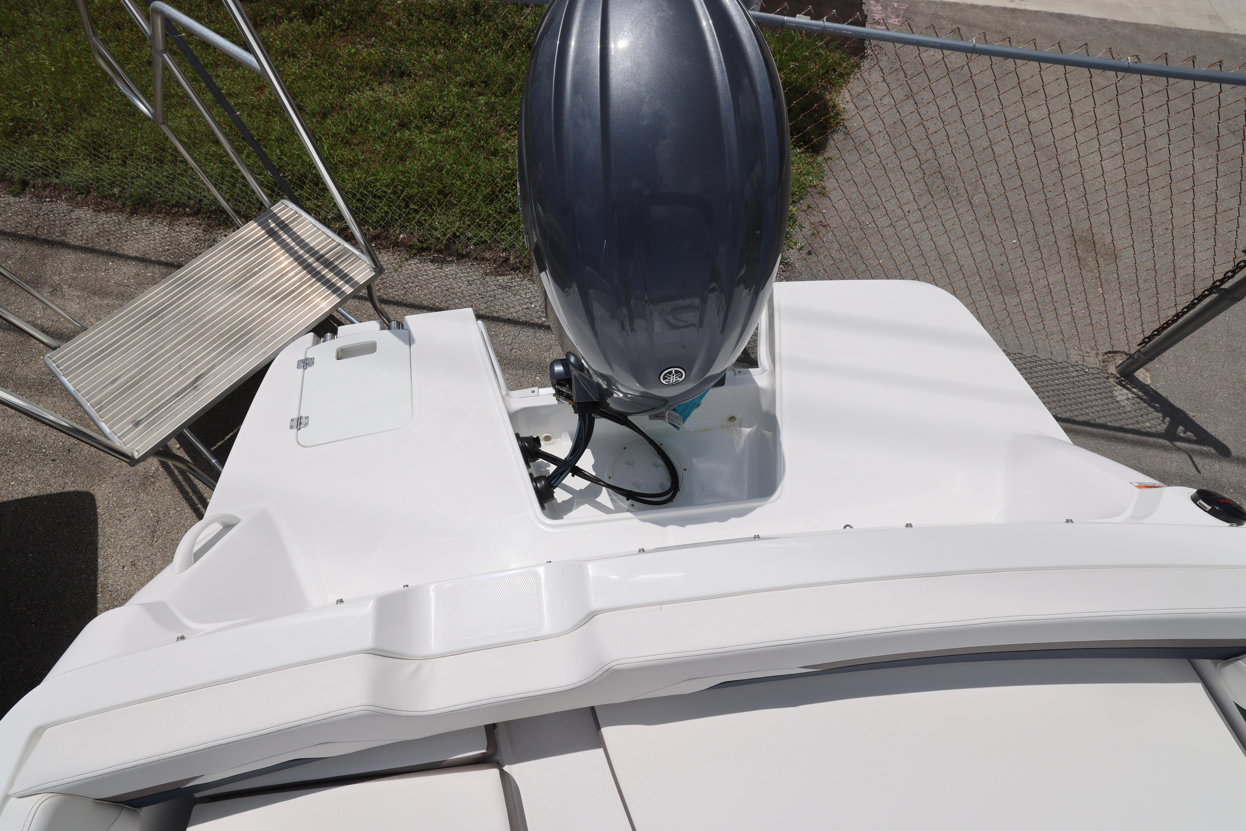 2026 Hurricane SunDeck Sport 205 OB boat with outboard motor, viewed from above.