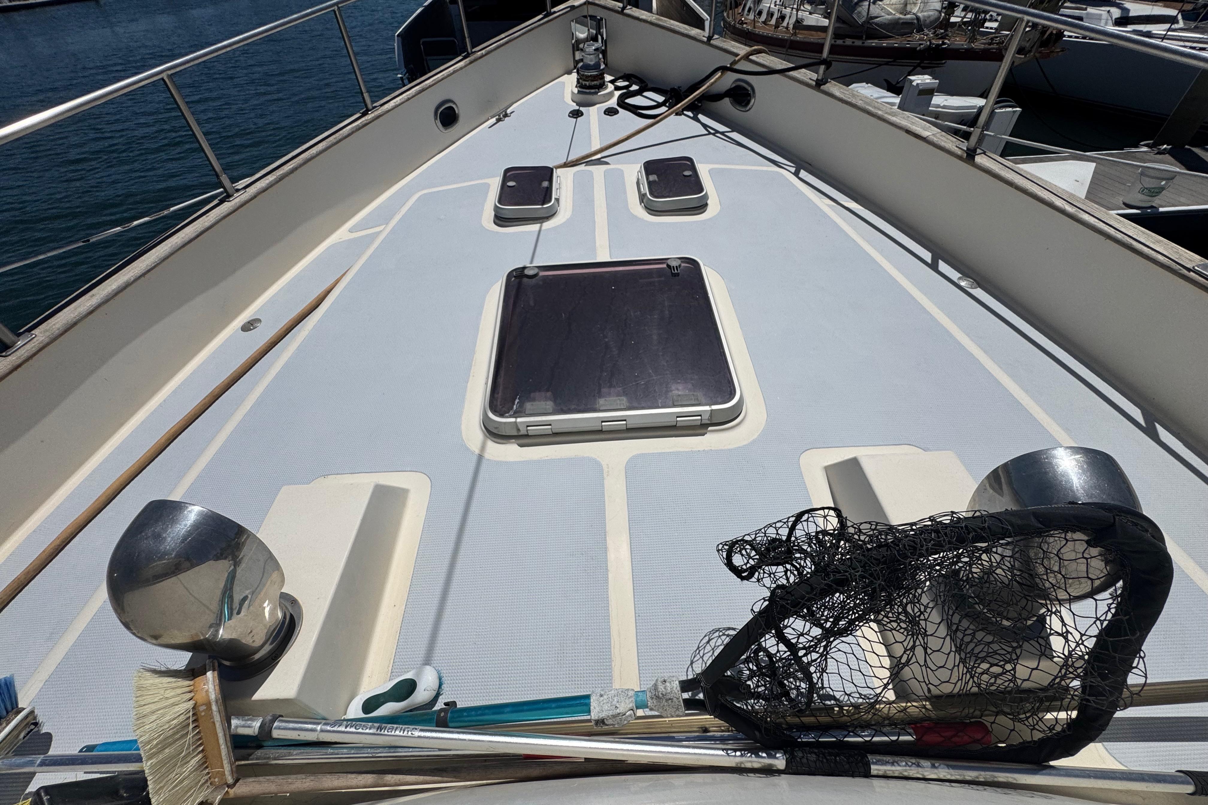 Deck of 1995 Nordhavn 46 yacht with hatches and marine equipment.
