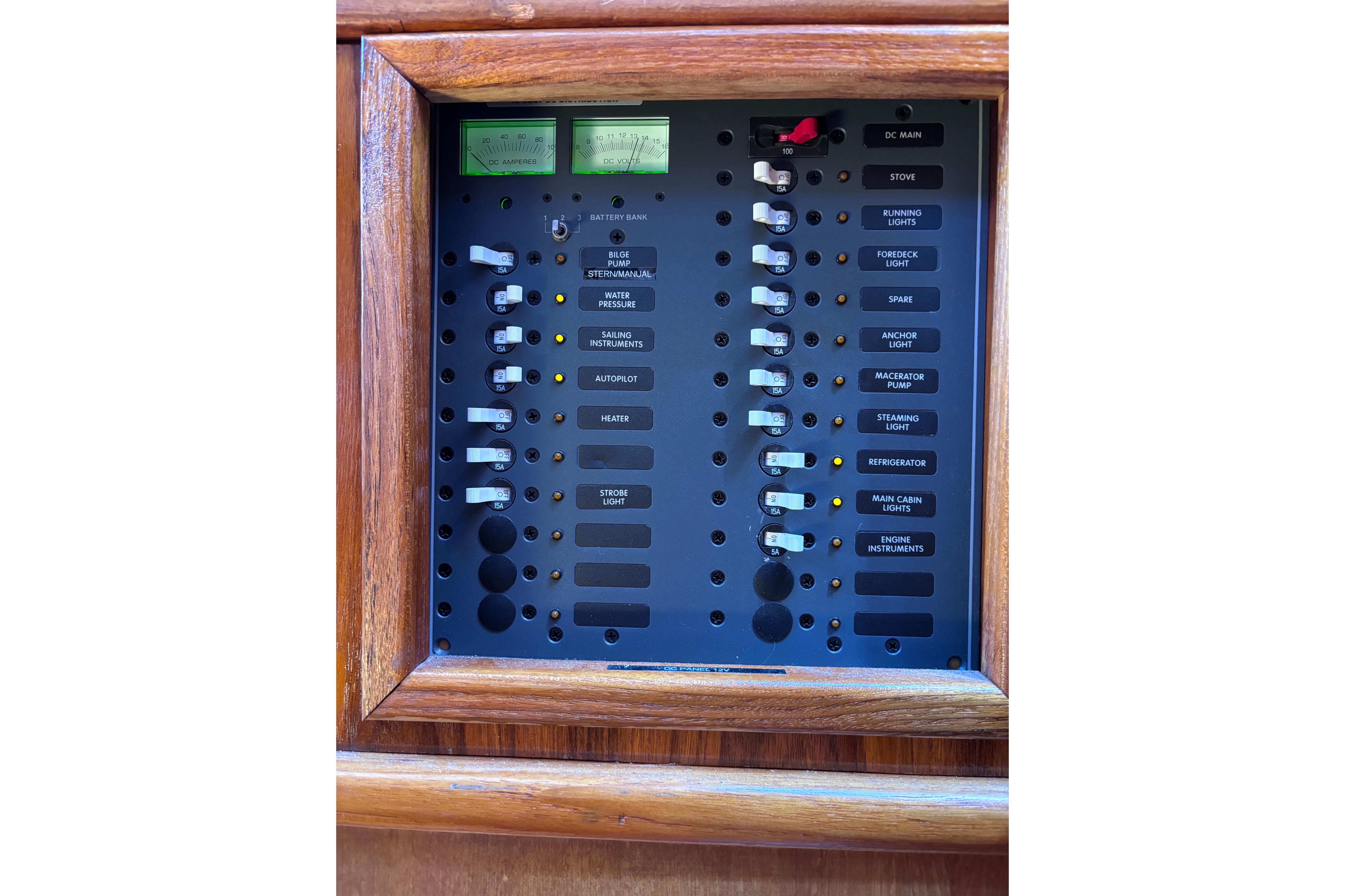 Electrical control panel on a 1978 Swift 33 boat, featuring various switches and indicators.