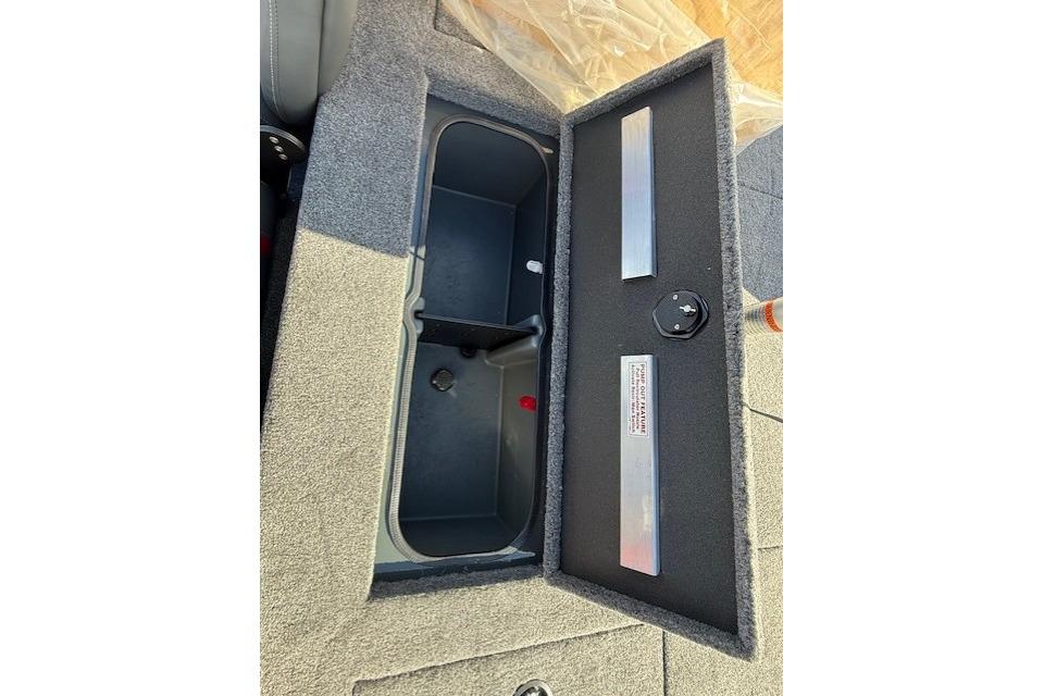 Open storage compartment in 2026 Ranger RT198P boat, featuring carpeted interior and secure latch.