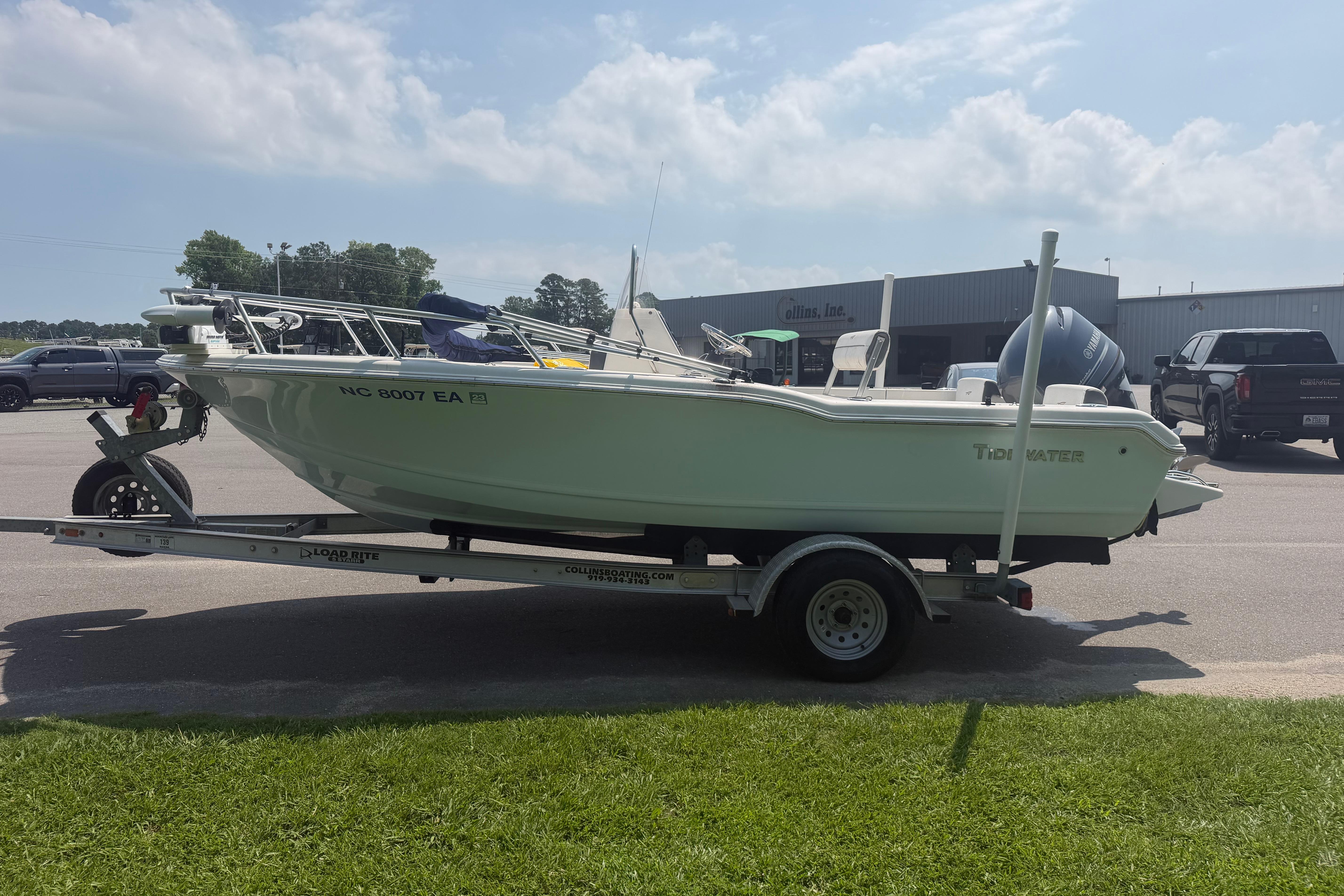 2015 Tidewater 180 CC Adventure boat on trailer in parking lot.