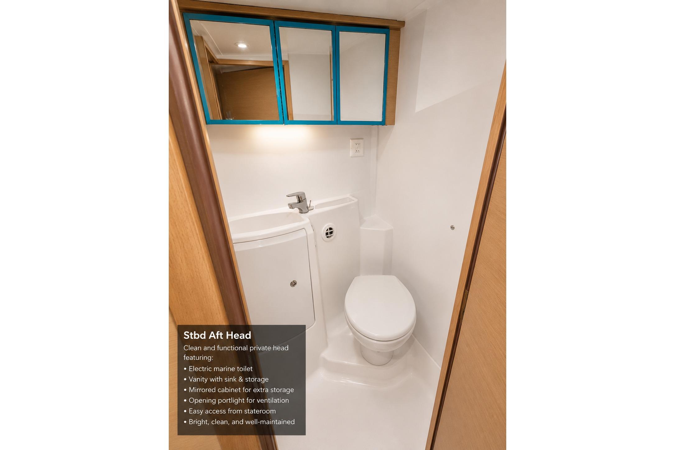 Clean and functional bathroom in 2010 Lagoon 421 yacht with electric toilet and storage.
