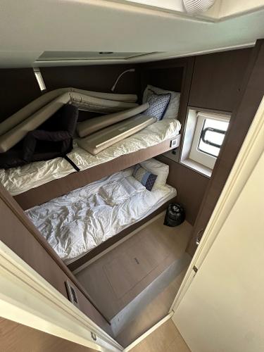 Interior of 2021 Bali 4.8 yacht with bunk beds and window.