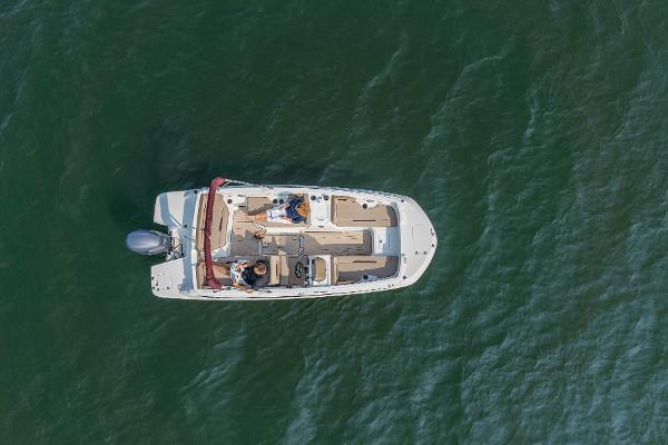 Aerial view of 2025 Hurricane SunDeck Sport 205 OB boat on water.
