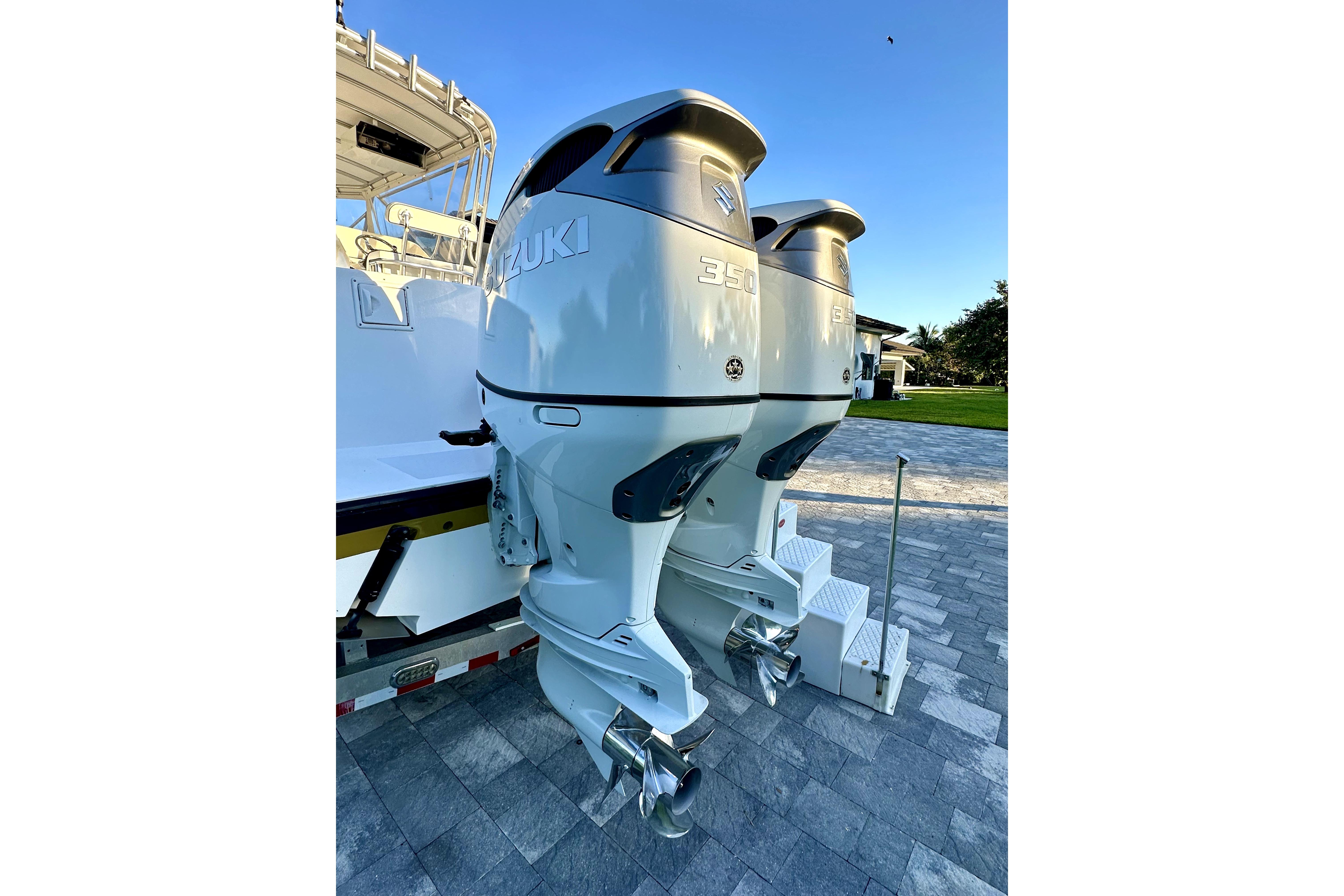 Twin Suzuki 350 outboard engines on a 2006 Contender 35 Express Side Console boat.
