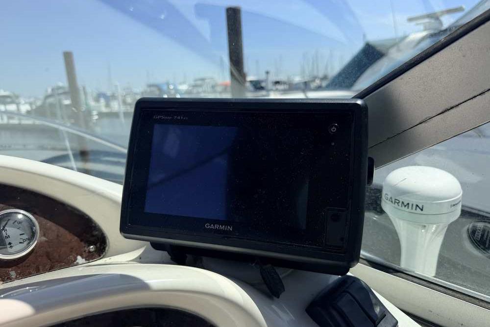 Garmin GPS device on 2001 Monterey 282 Cruiser dashboard at marina.