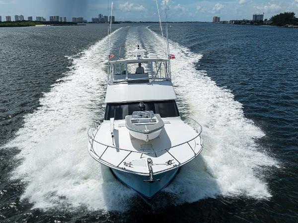 2000 Viking 50 Convertible yacht cruising on open water, leaving a wake behind.