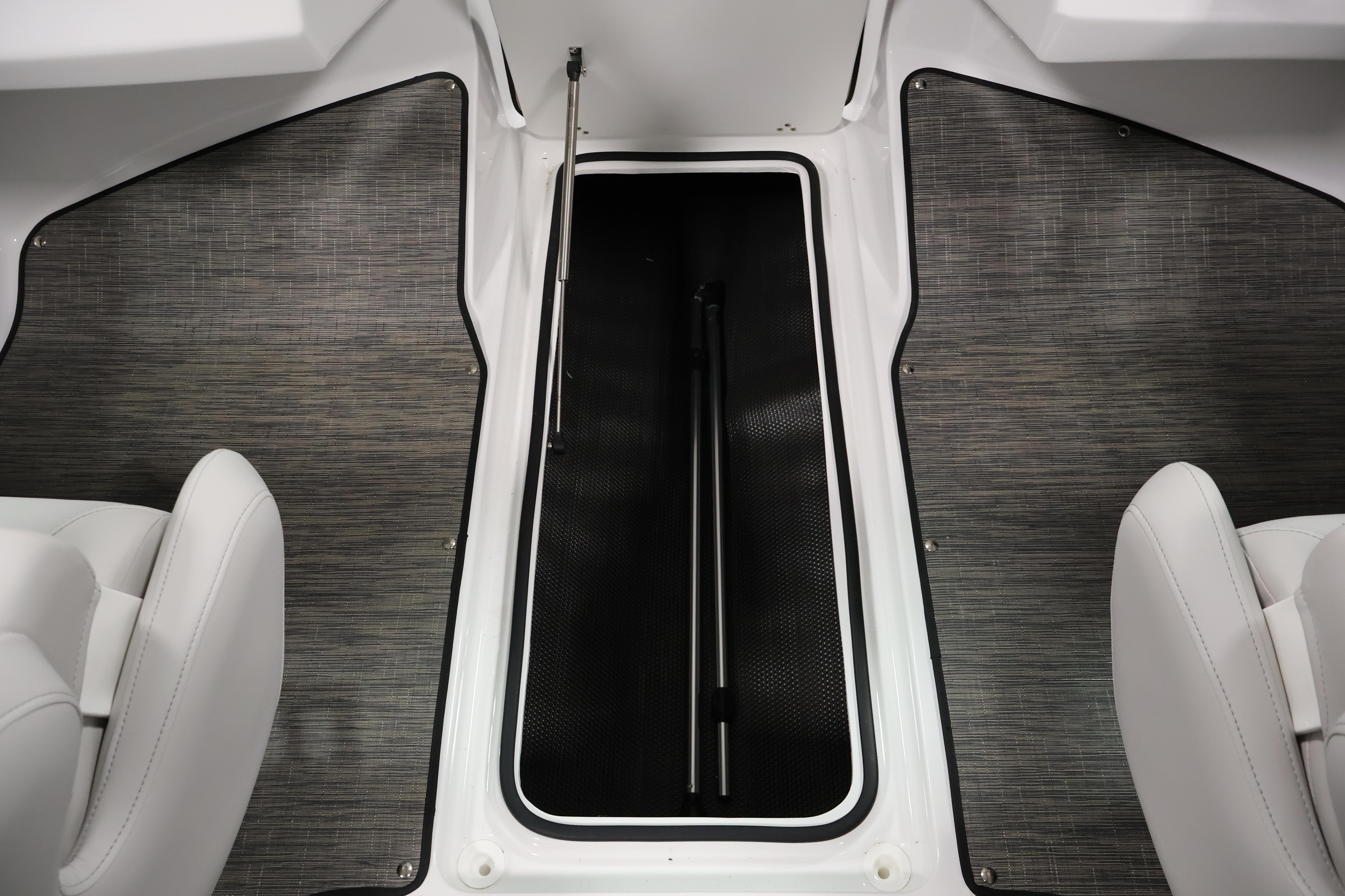 Interior view of 2026 Four Winns H4 Freedom boat storage compartment.