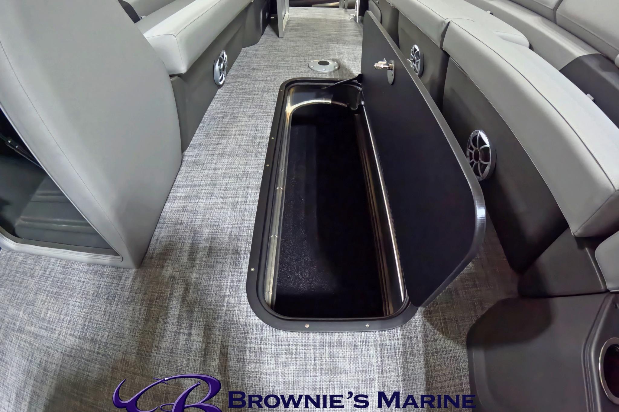 2026 Sun Tracker Party Barge 24 XP3 interior storage compartment, gray seating, and flooring.
