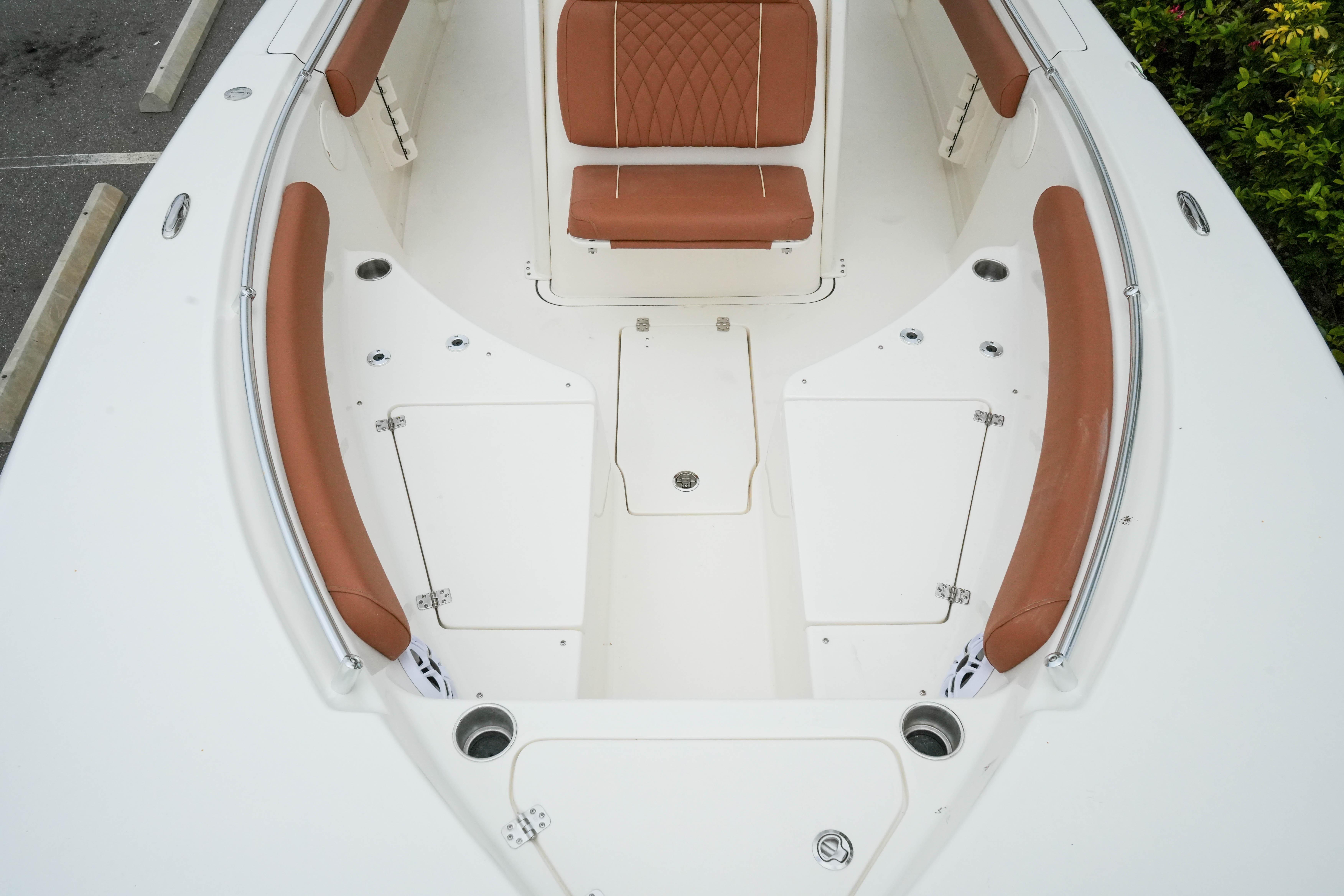 2026 Key West 244 Center Console boat interior with brown seating and white deck.