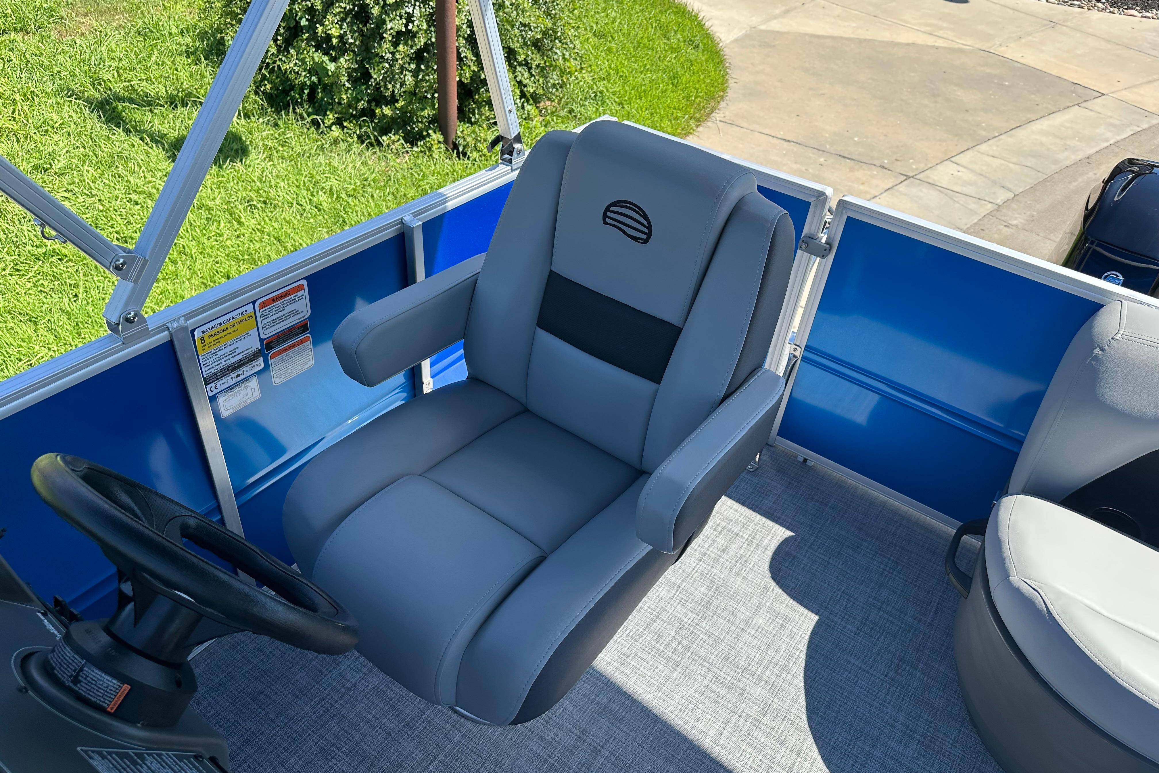 Captain's chair on 2026 Sun Tracker Party Barge 16 DLX pontoon boat.
