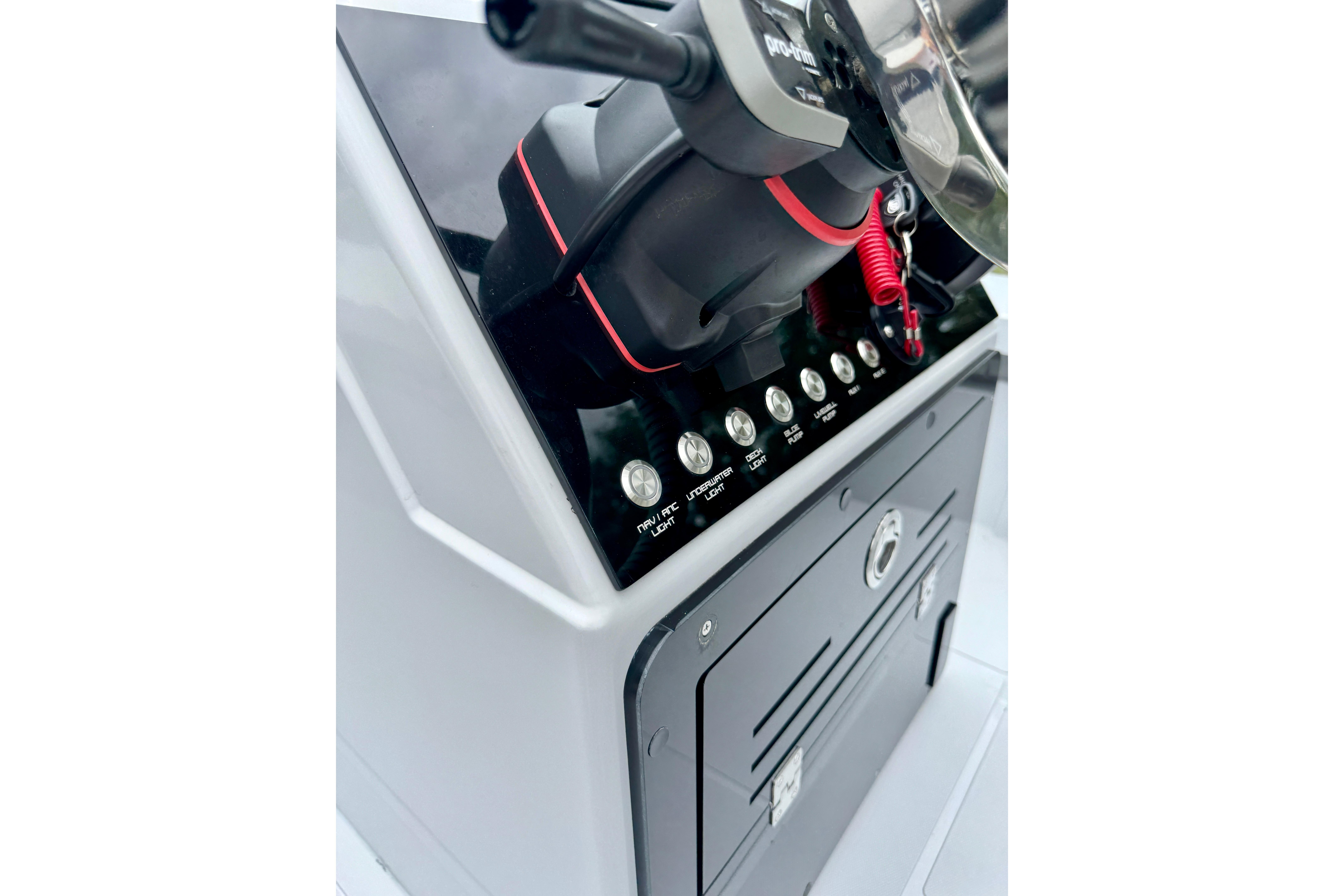 Control panel of 2025 Hayaari Marine H Skiff 18 boat, featuring switches and steering wheel.