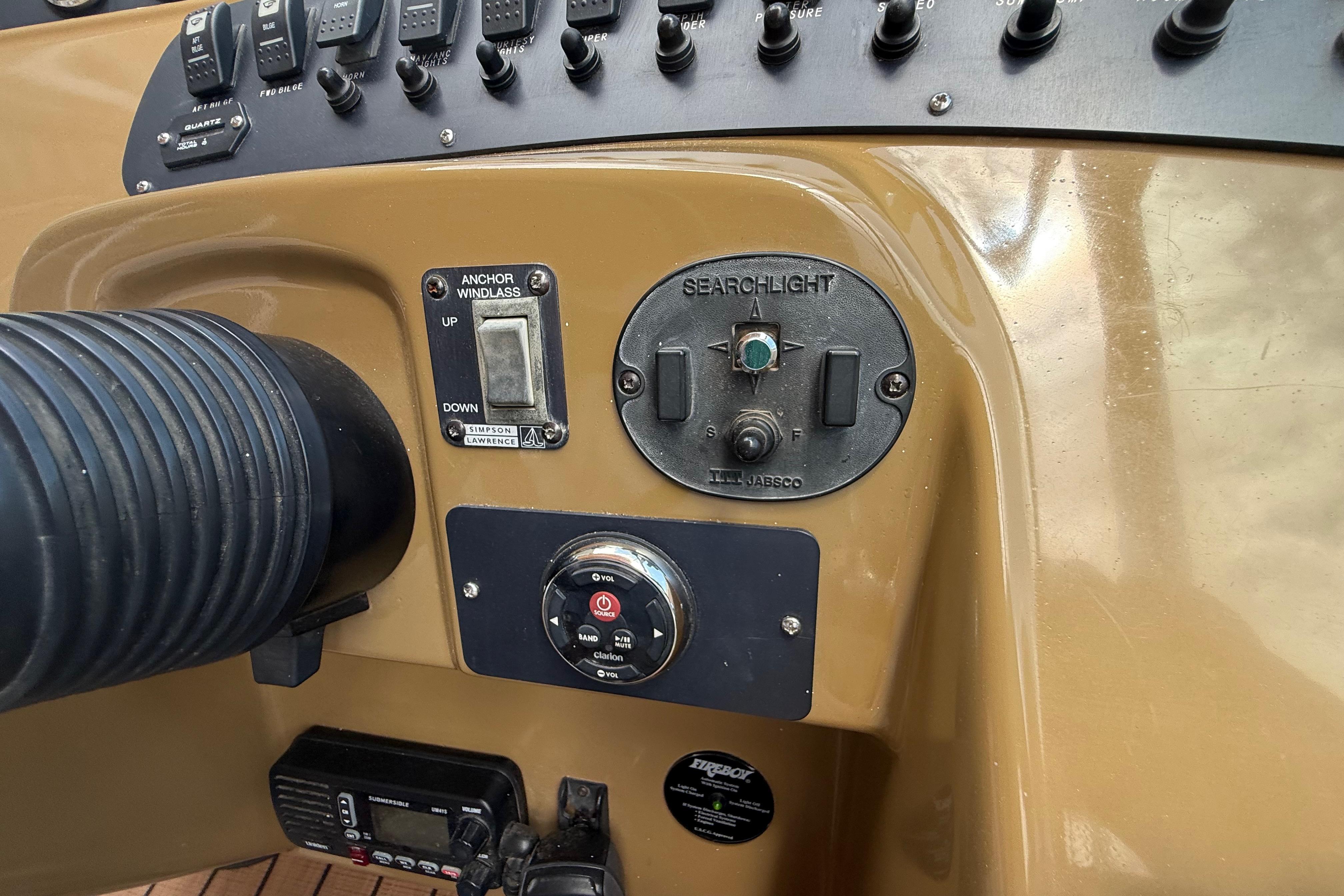 Control panel of a 1999 Chaparral Signature 300 boat with switches and dials.
