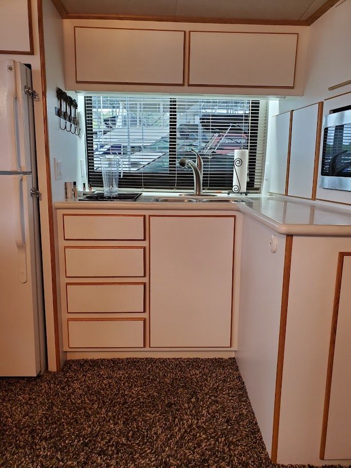 Compact kitchen on a 1996 Blue Water motor yacht.