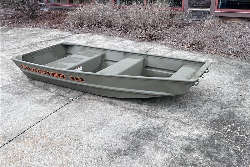 2026 Tracker Grizzly 10 Jon boat on concrete surface, outdoors.