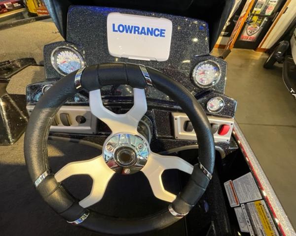 Steering wheel and dashboard of 2025 Nitro Z19 boat with Lowrance display.