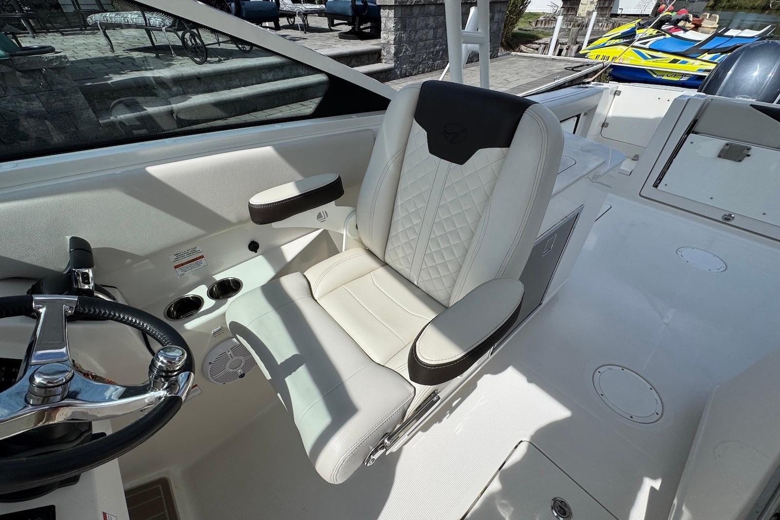 Luxury seating on 2022 Sailfish 276 DC boat, featuring premium upholstery and sleek design.