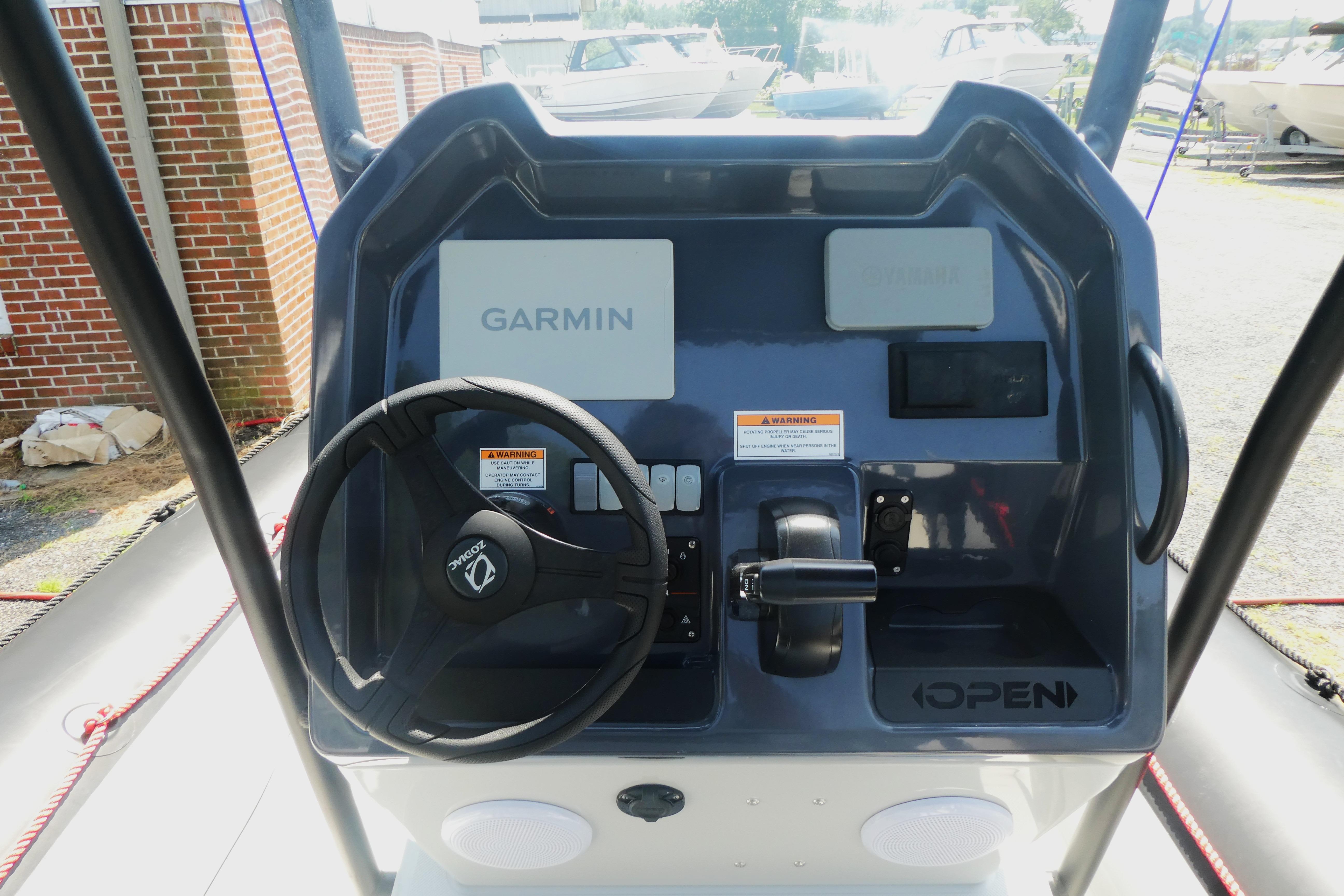 Control panel of 2022 Zodiac Pro 5.5 boat featuring Garmin navigation system.