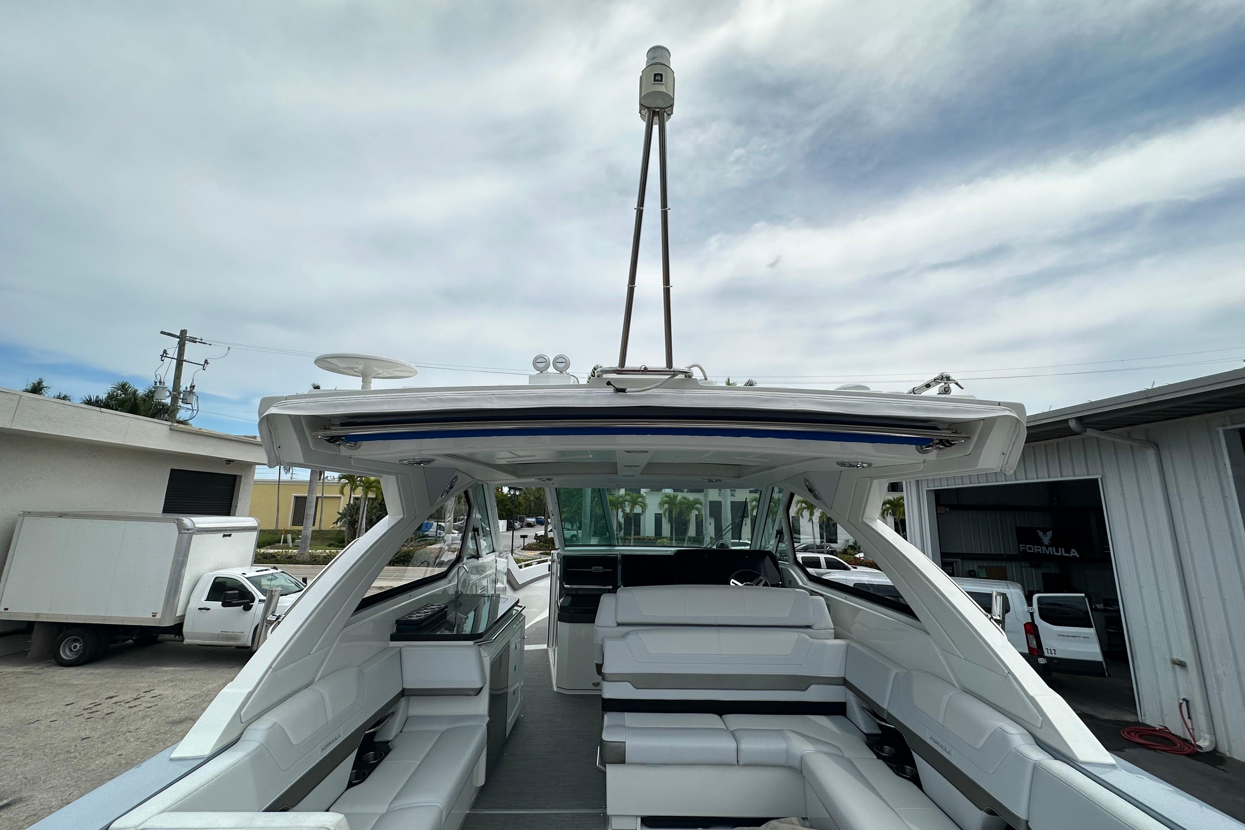 2021 Formula 380 Super Sport Crossover OB boat with spacious seating and modern design.