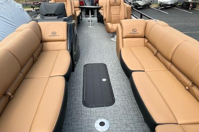 Luxurious 2026 Regency 250 DL pontoon boat with tan leather seating and modern design.