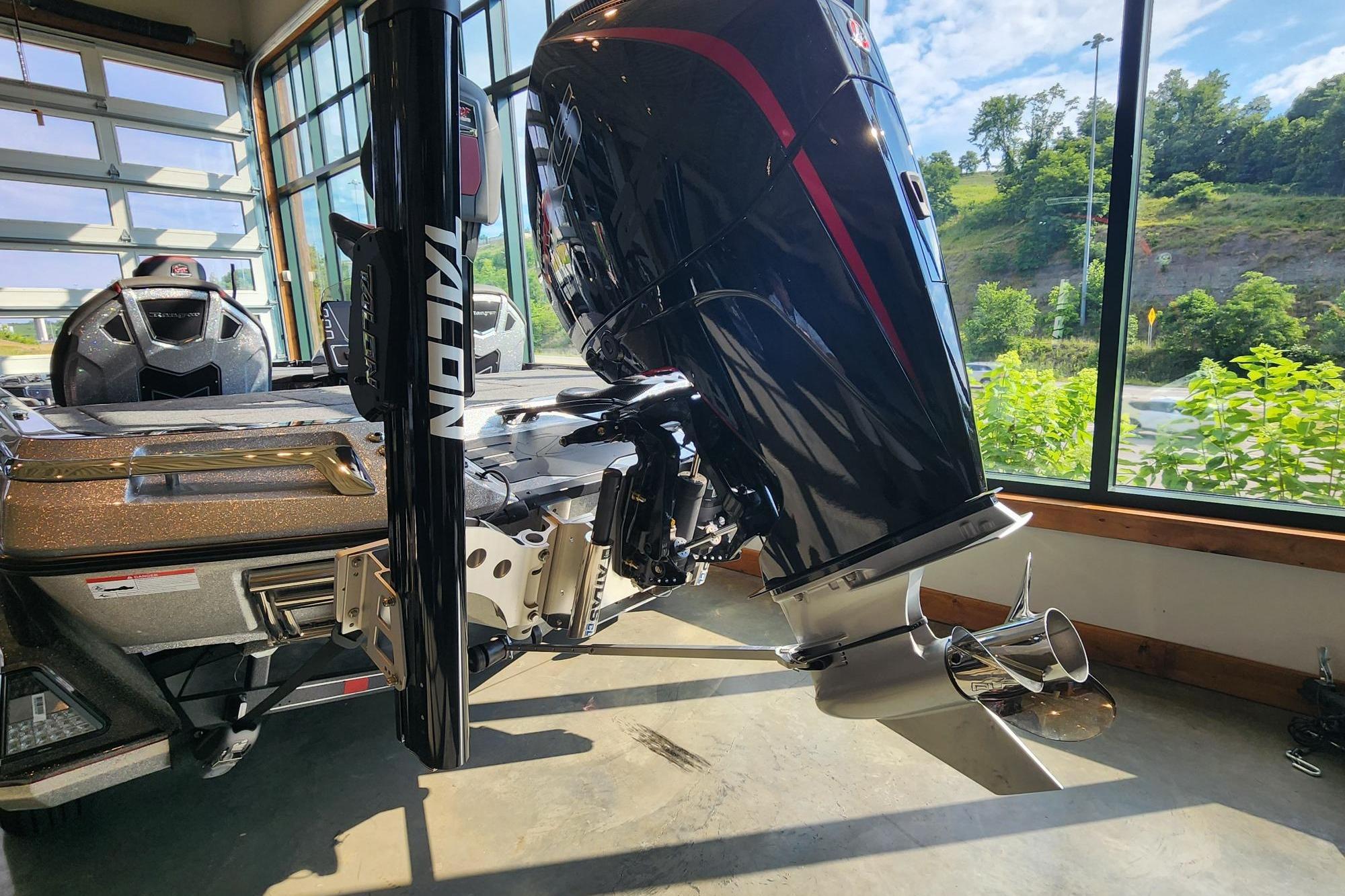 2026 Ranger Z519R boat with Talon anchor system, showcased indoors with scenic outdoor view.