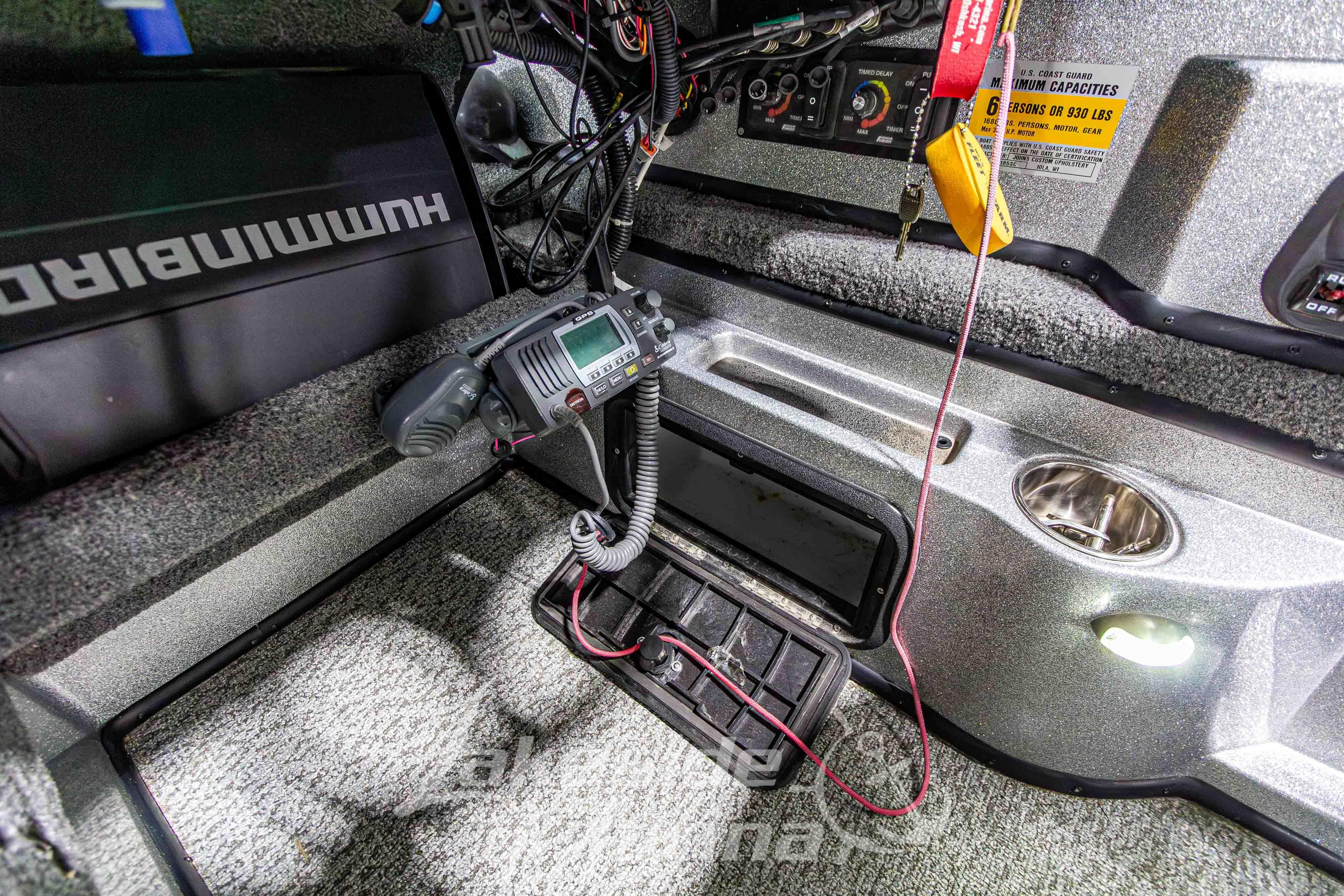 Interior of a 2019 Recon 2185 SC boat with electronic equipment and control panel.