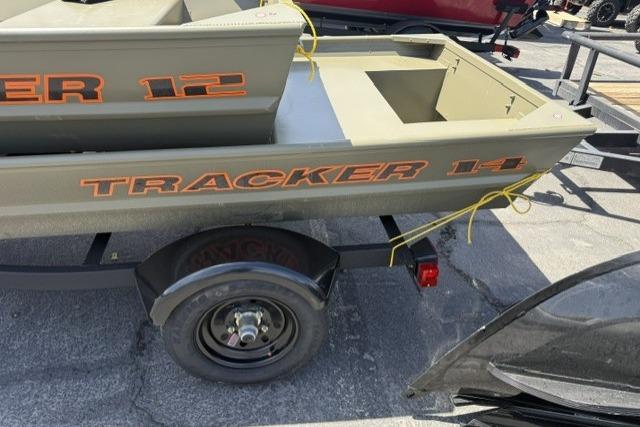 2026 Tracker Grizzly 14 Jon boat on trailer, featuring bold orange lettering.