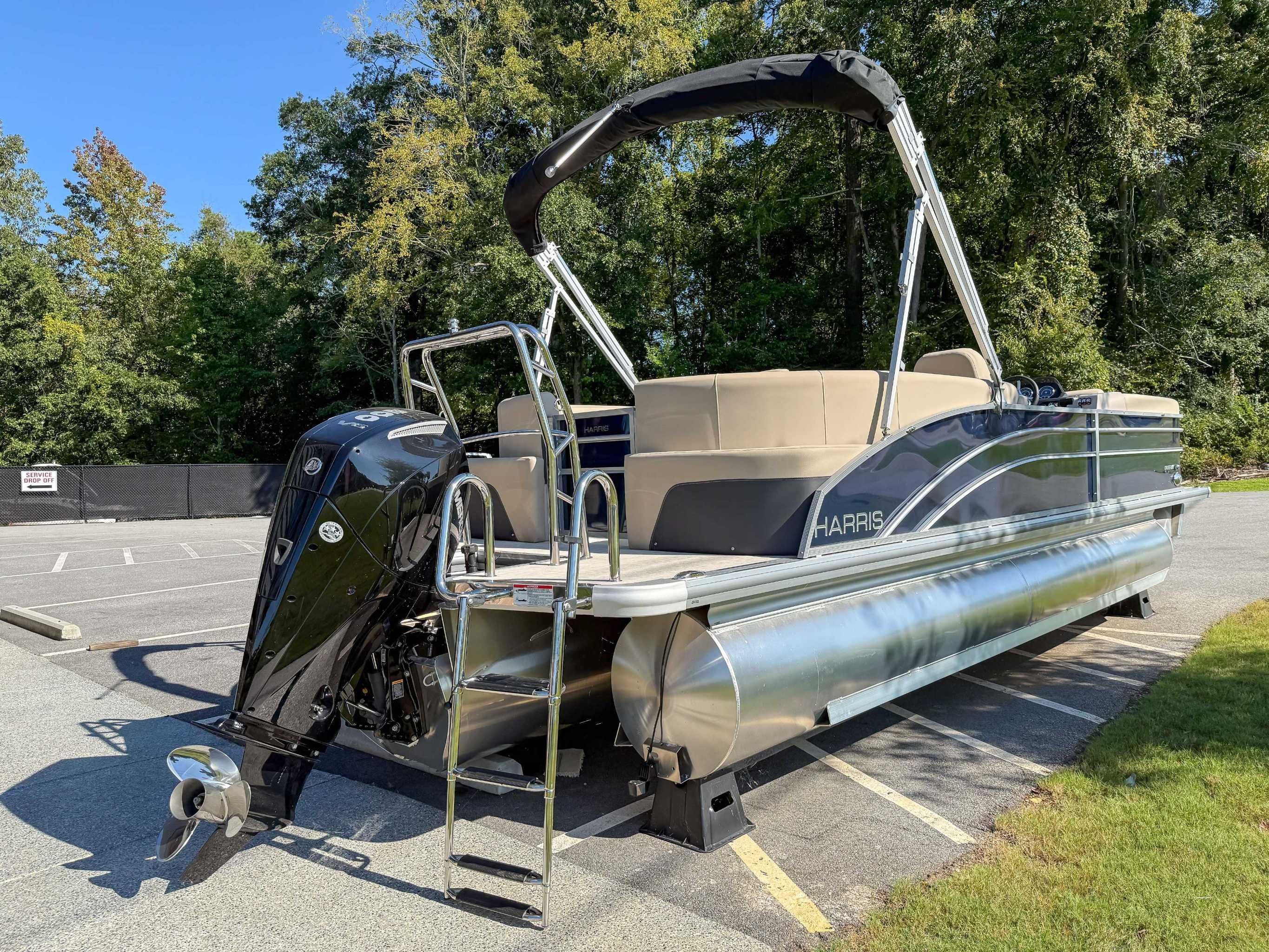 2025 Harris Cruiser 250 CWDH pontoon boat parked outdoors.