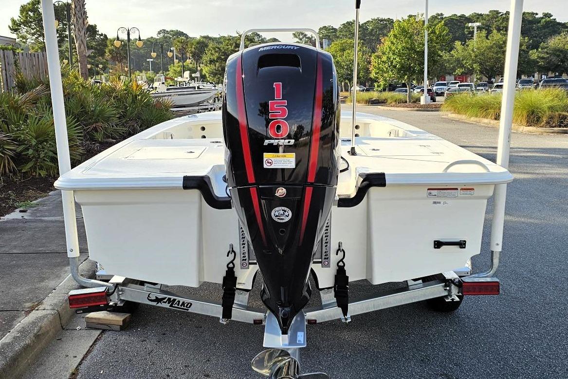 2026 Mako 18 Pro Skiff with 150 HP Mercury outboard engine, parked on a trailer.