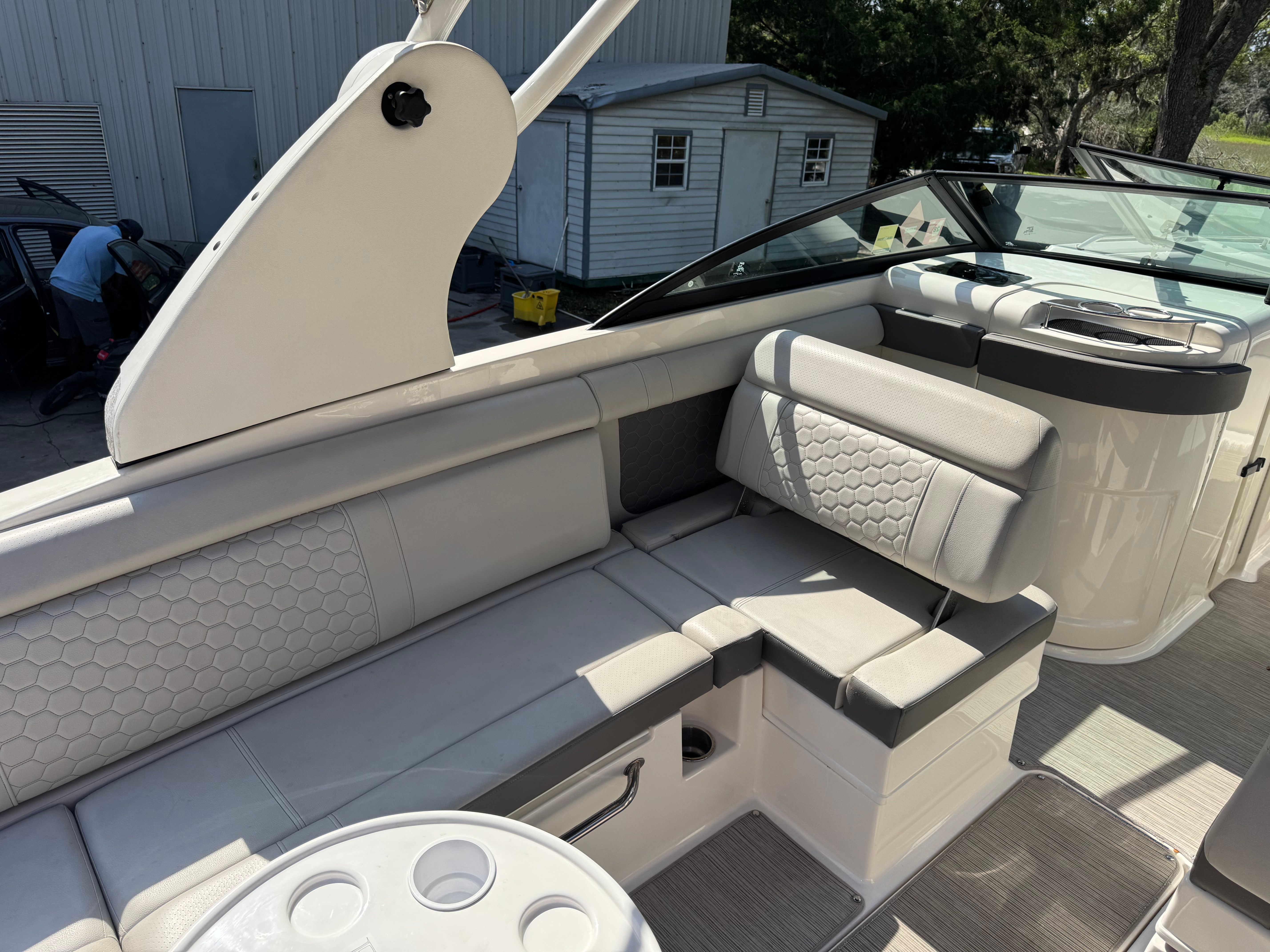 Interior of a 2020 Sea Ray SDX 270 Outboard boat with gray upholstery.