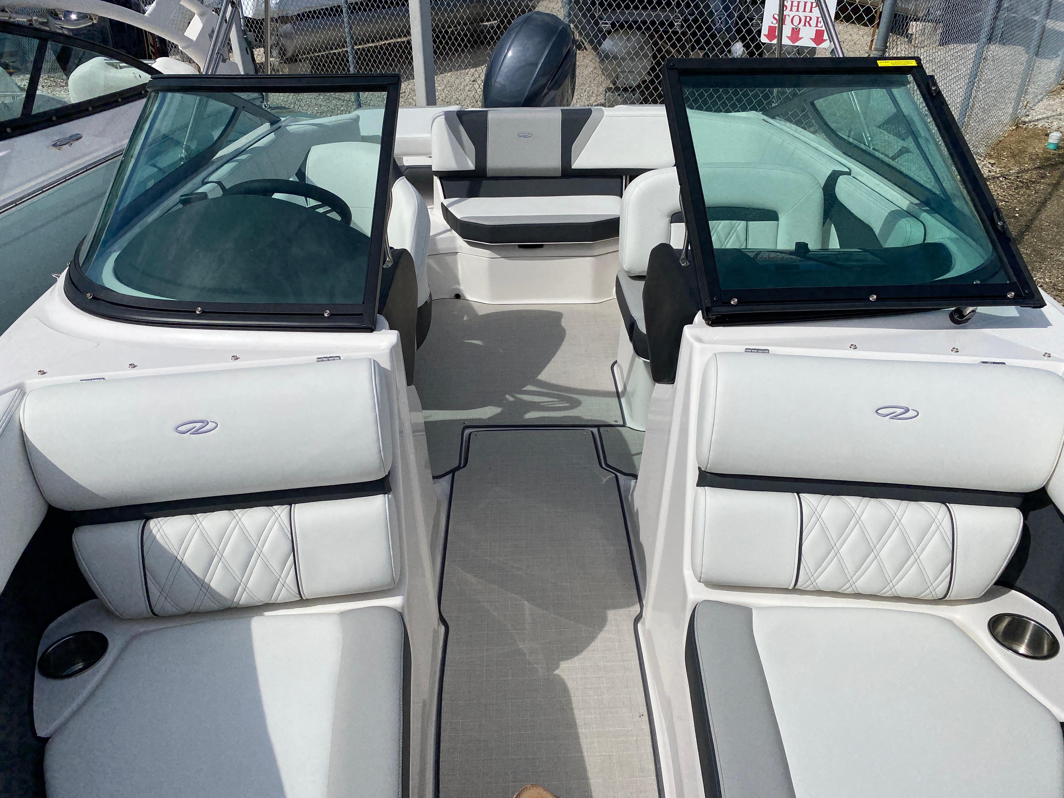 2026 Regal 21 OBX boat interior with white seating and open windshield.