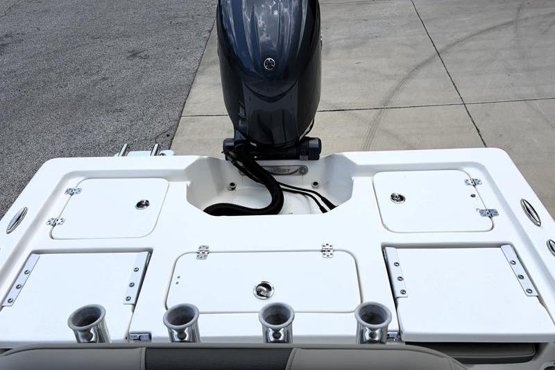 2025 Key West 210 Bay Reef boat stern with motor and storage compartments.