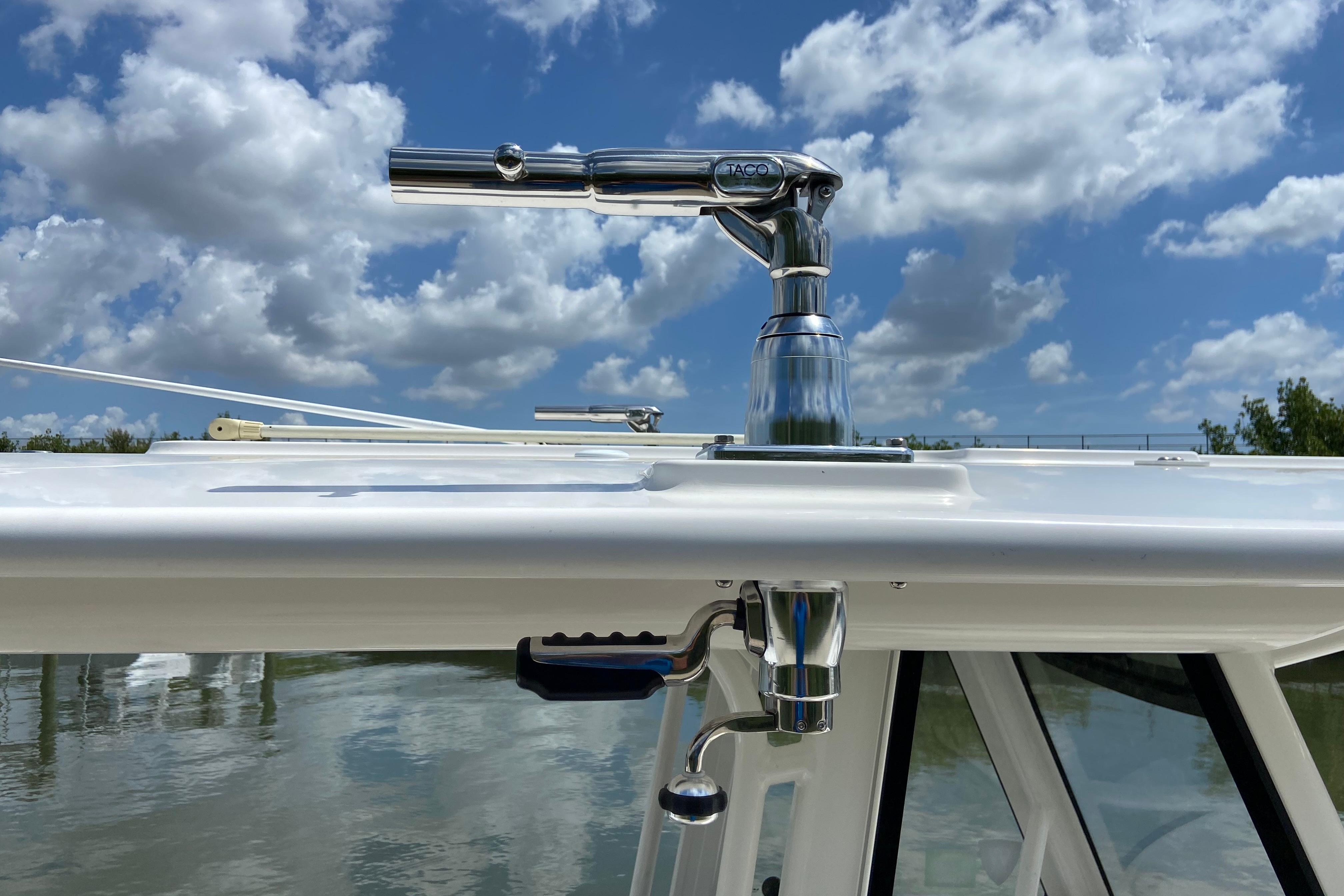 2021 Regulator 28 boat with polished metal fittings against a cloudy sky backdrop.